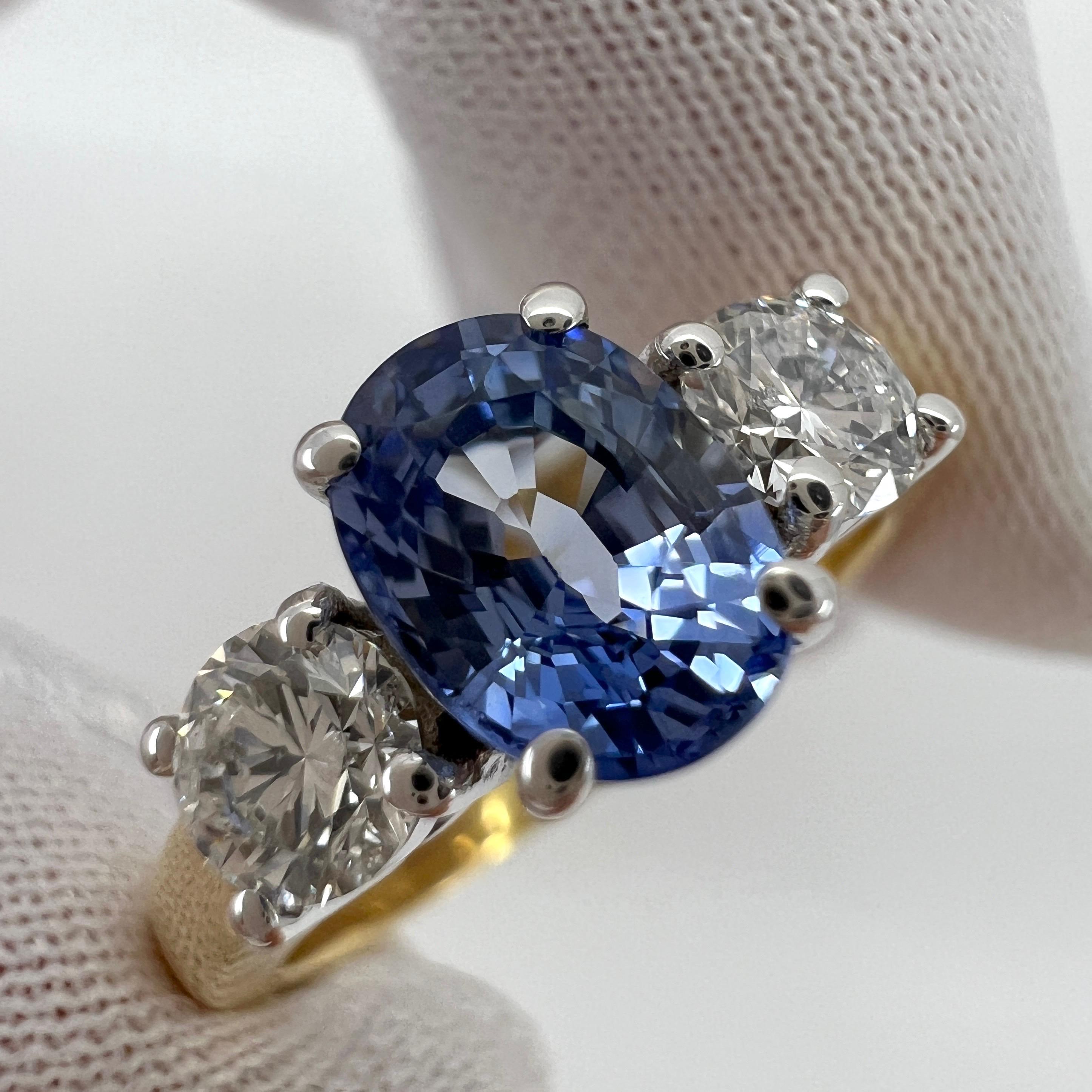 Fine Vivid Blue Oval Cut Ceylon Sapphire & Diamond Three Stone 18k Gold Ring. 1.78 Total Carat Weight.

Fine colour Ceylon blue oval cut sapphire centre stone. 1.28 Carat measuring 7x5mm. This sapphire has an excellent oval cut and excellent clarity