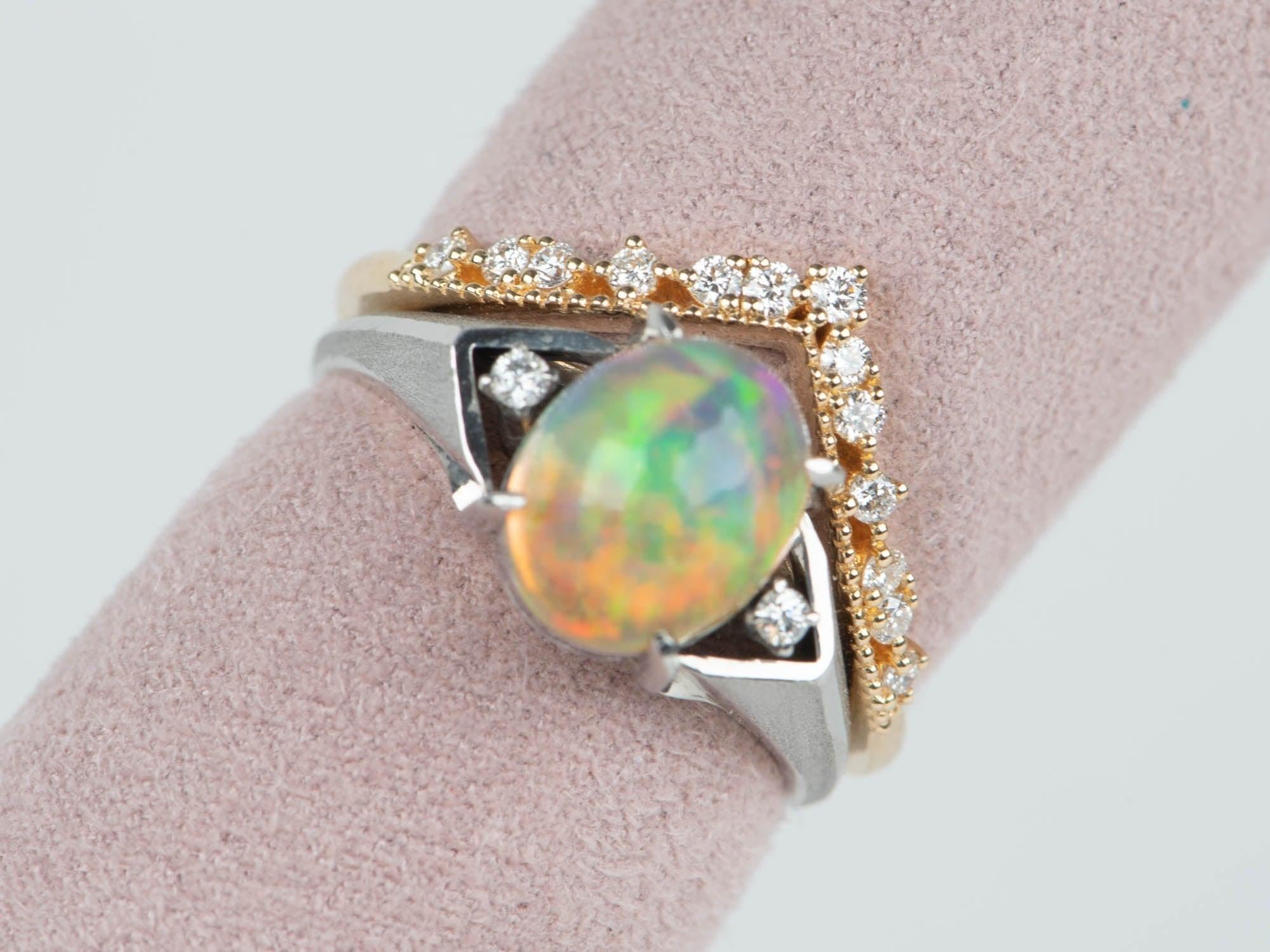 ♥ This is a gorgeous ring set with an oval opal in the center, surrounded by 0.03ct worth of diamonds.
♥ The item measures 9.3mm in length (North South direction), 14.2mm in width (East West direction), and stands 9.5mm from the finger.


♥ You are