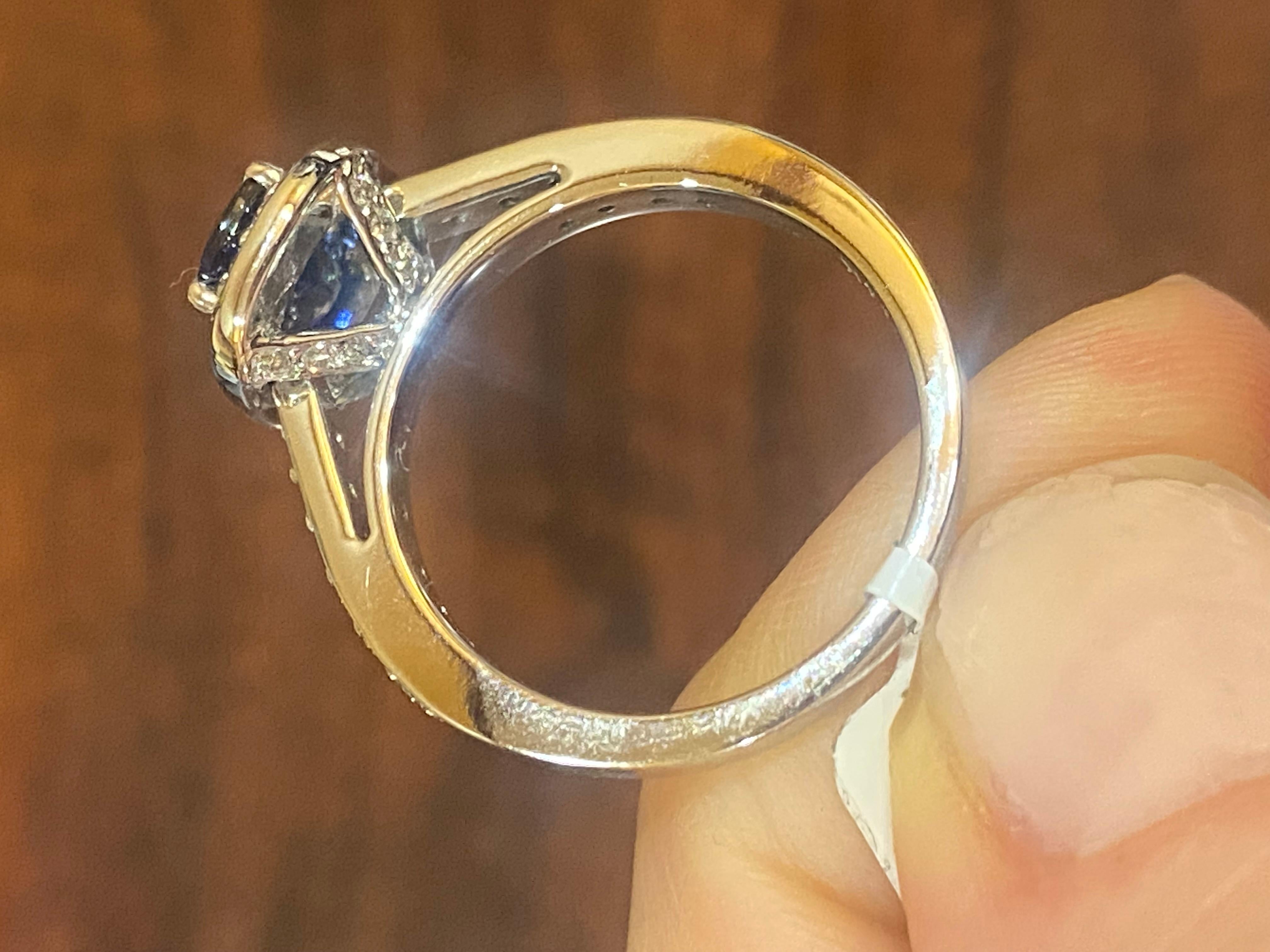14KT White Gold
Finger Size: 6.5
(Ring is a size 6.5 but can be re-sized upon request)

Number of Emerald Cut Sapphires: 1
Carat Weight: 1.30ctw
Stone Size:  7.35 x 4.5mm

Number of Round Diamonds: 40
Carat Weight: 0.48ctw

This ring showcases a