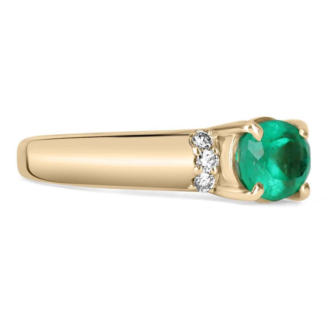 Displayed is a Colombian emerald & diamond accent ring in 18K yellow gold. This gorgeous ring carries a full 1.60-carat emerald in a four-prong setting. Fully faceted, this gemstone showcases excellent shine. The emerald has good clarity with minor
