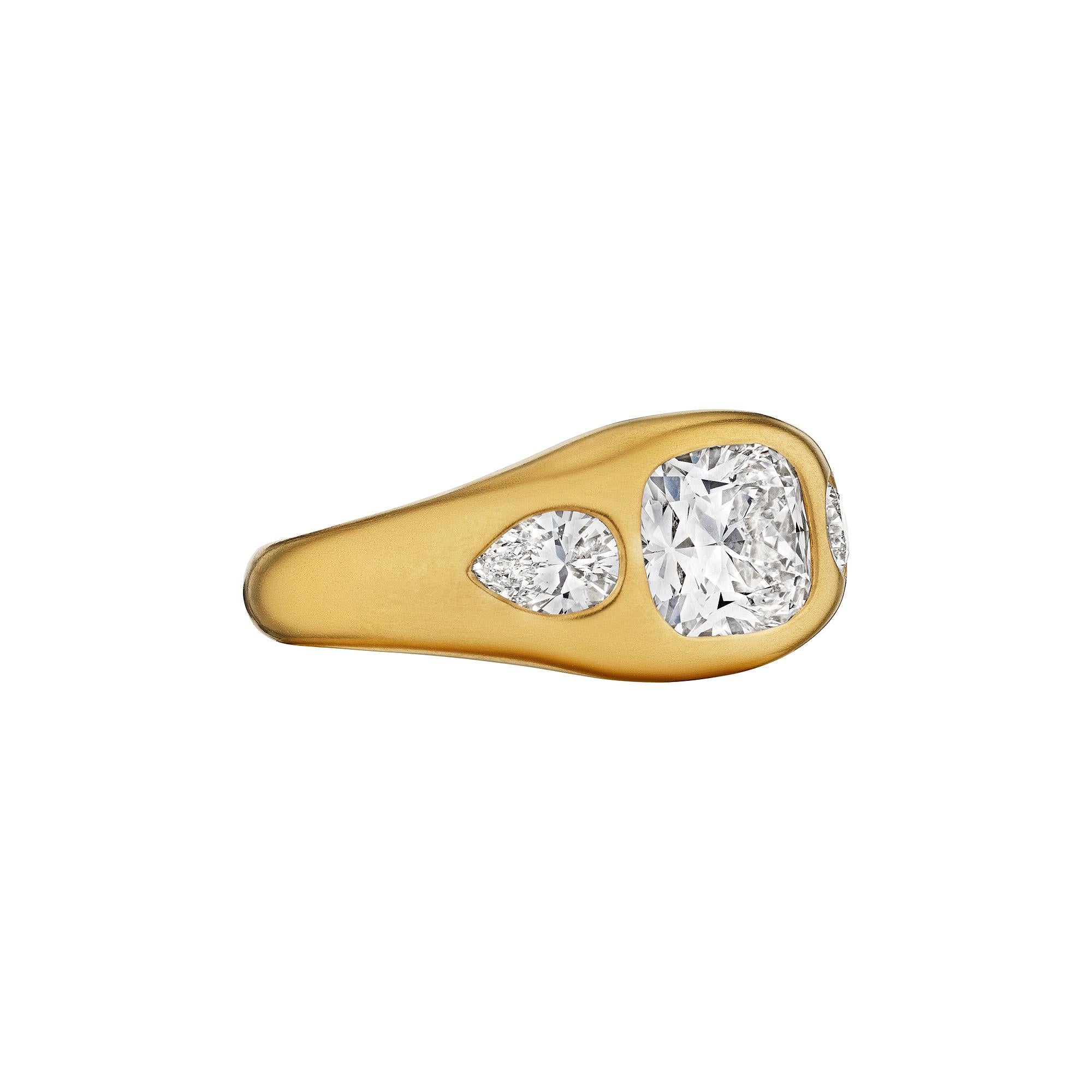 Both soulful and sultry, this 1.79-carat cushion brilliant cut diamond and 18 karat yellow gold burnished set ring, with a chic matte finish, is uncompromising.  Handmade by Steven Fox Jewelry, the center cushion diamond sports two pear shape side