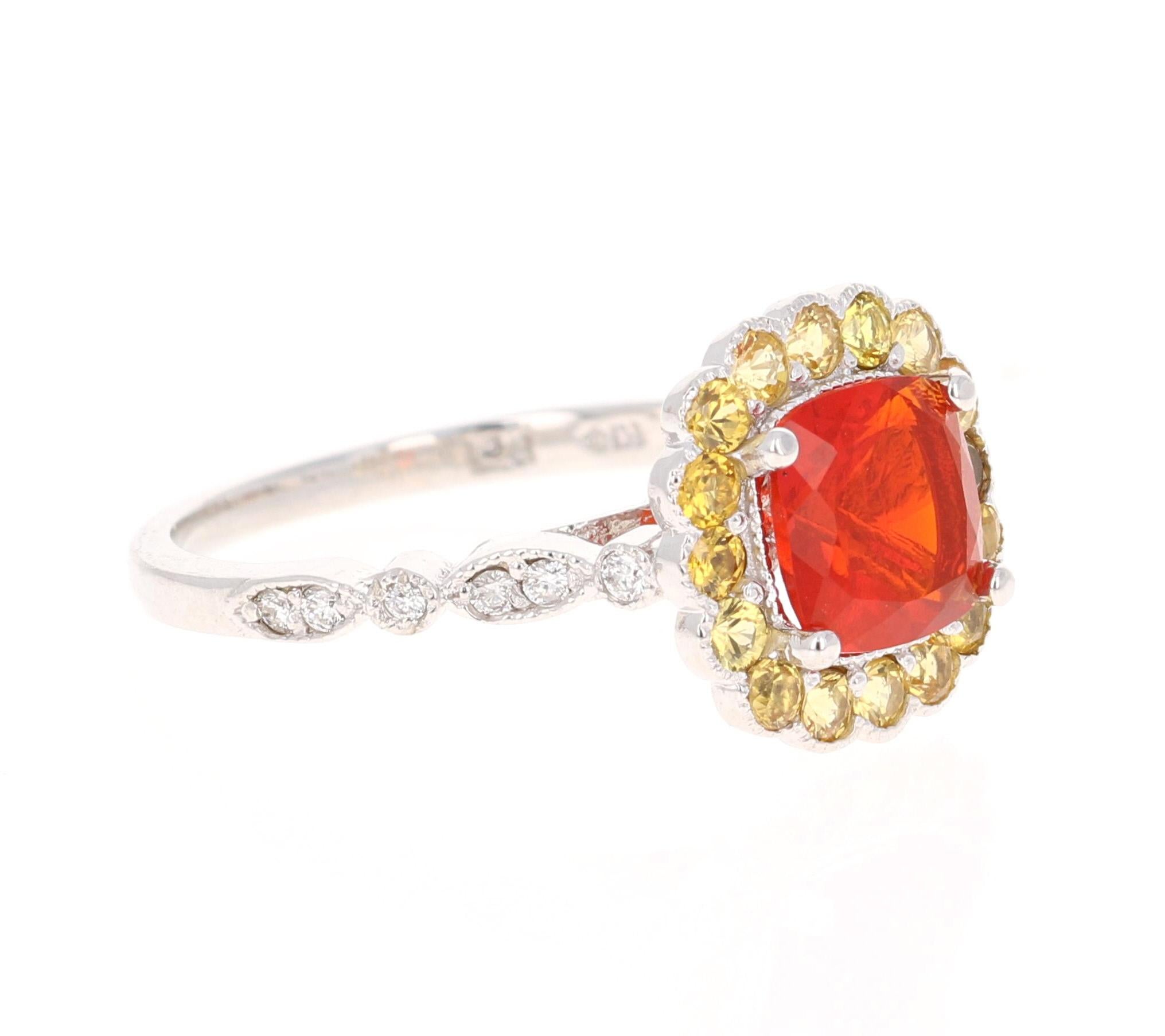 1.79 Carat Cushion Cut Fire Opal Diamond 14 Karat White Gold Ring

This uniquely designed ring has a 0.97 carat Cushion Cut Fire Opal in the center of the ring.  The Fire Opal is surrounded by 16 Round Cut Yellow Sapphires that weigh 0.69 carats and