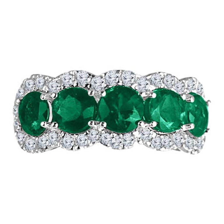 Adorn your finger with a piece of unparalleled beauty and sophistication. This ring isn't just a piece of jewelry; it's a symbol of timeless elegance and refined taste.

At its heart lie five mesmerizing round-cut emeralds, each one capturing the