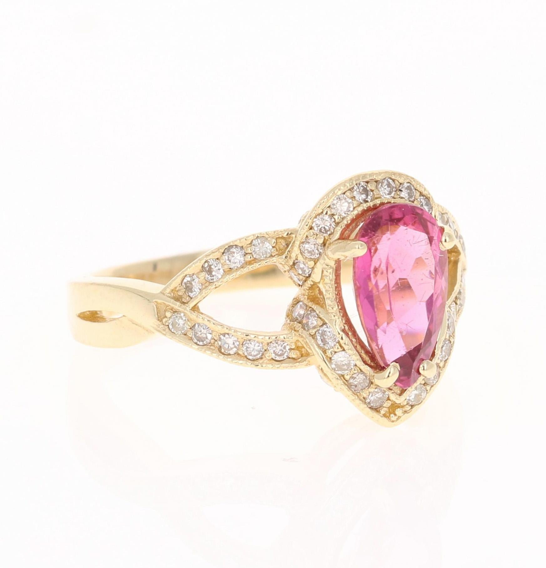 This ring has a pretty Pear Cut Pink Tourmaline that weighs 1.38 Carats. Floating around the tourmaline is 51 Round Cut Diamonds that weigh 0.41 Carats. The total carat weight of the ring is 1.79 Carats.   The measurements of the Tourmaline are 6mm