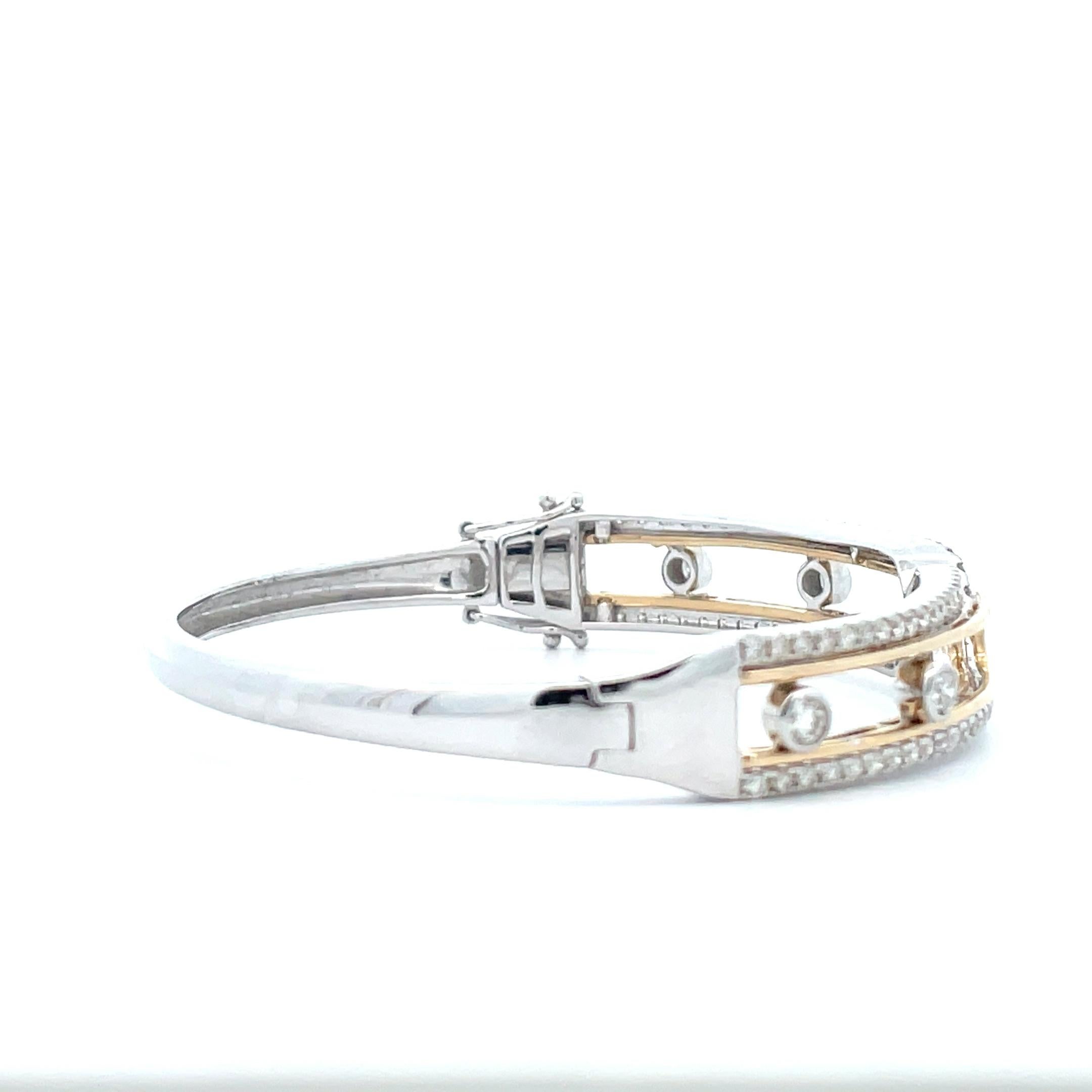 Our floating diamond bangles are handcrafted in 14K solid gold, featuring a criss-cross design with diamonds that slide from one side to another. Our 14k solid gold diamond bangles feature a secure locking mechanism which keeps the diamonds in