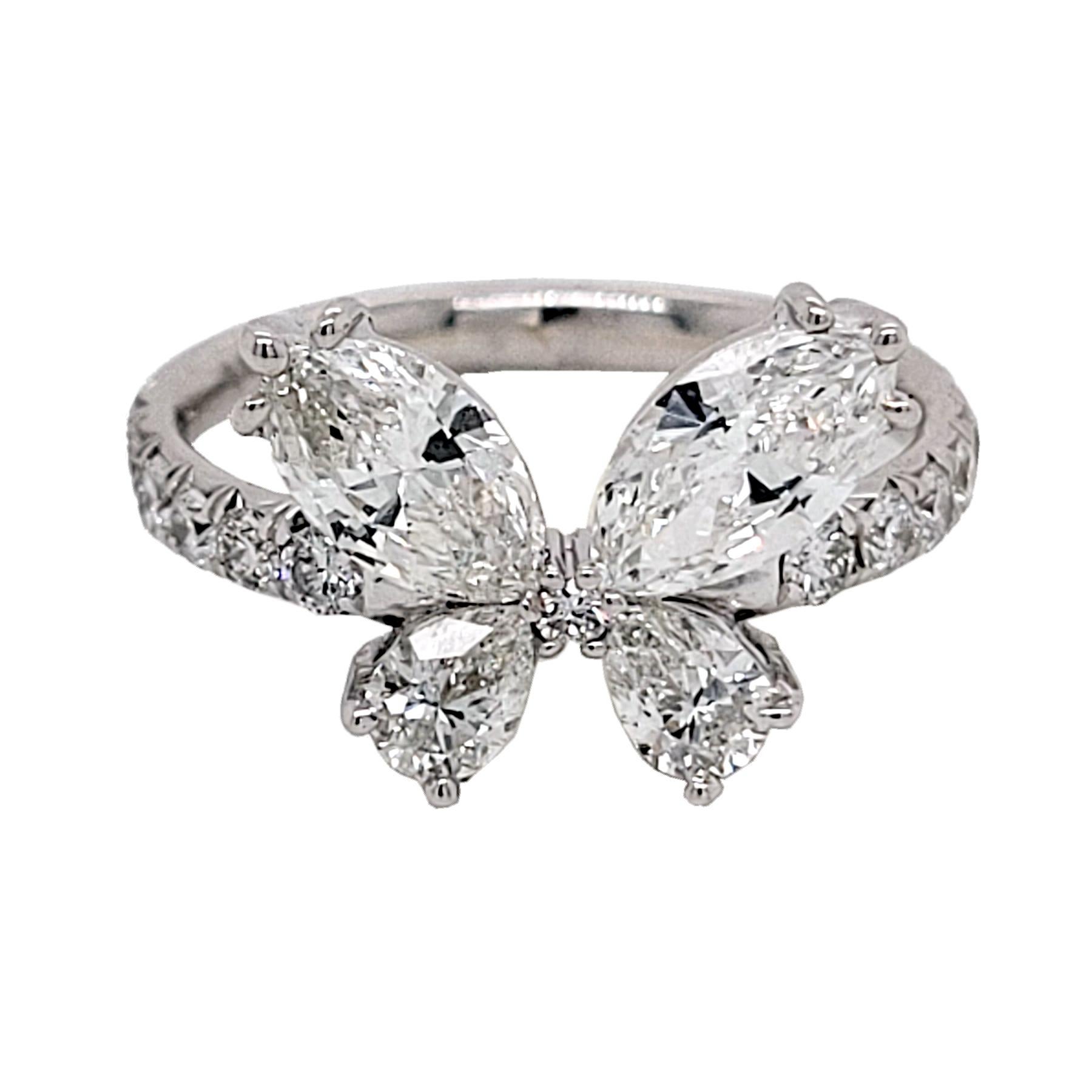 Five perfectly Match Diamonds at the top assemble into a Butterfly shape set on top of French Pave Set Shank.  This beautiful fun ring made if 18K White Gold.
Stones:
Diamonds: 2 Marquise Shaped (TW:1.03 Ct) and 2 Pear Shaped Diamonds (TW:0.38 Ct)