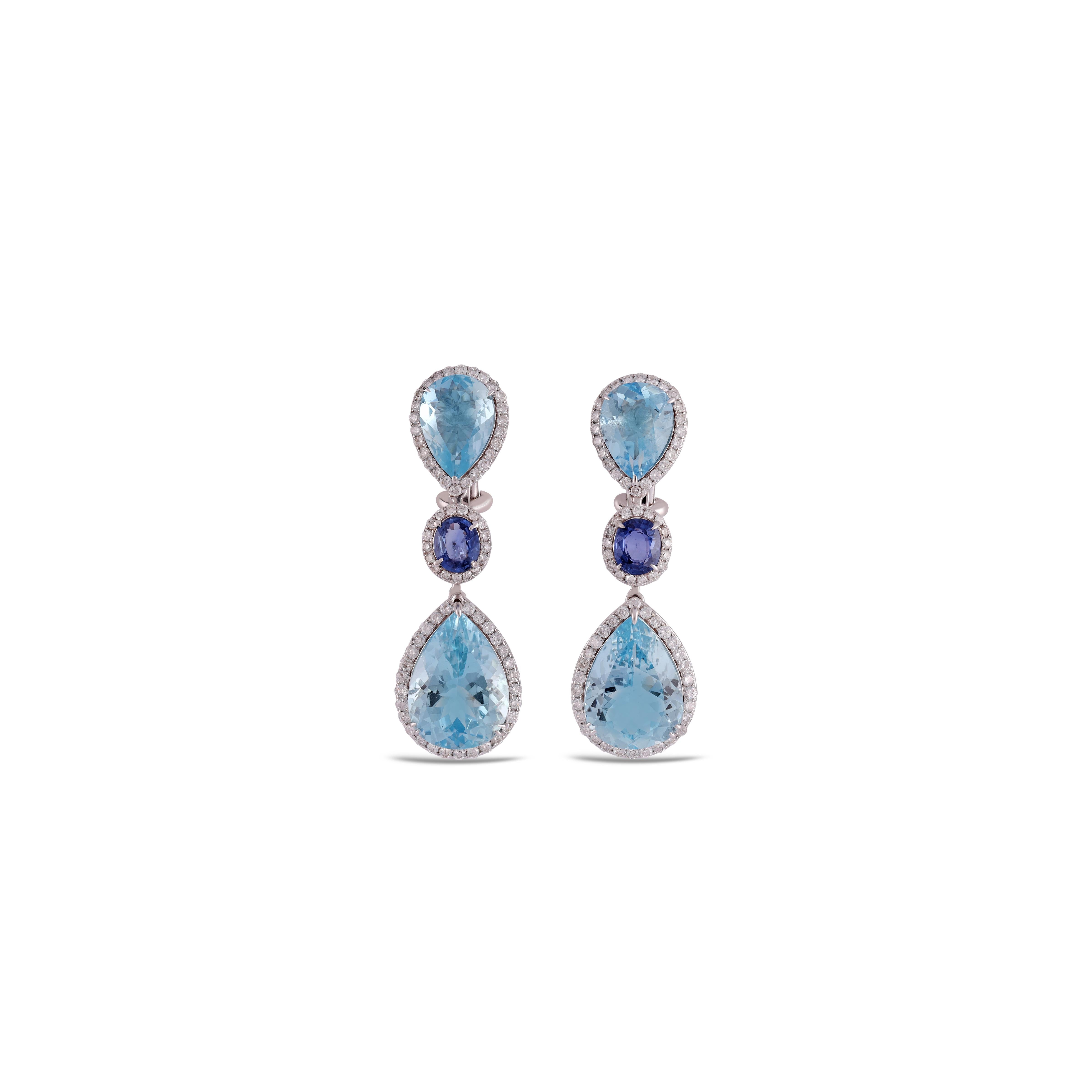 This is an elegant Aquamarine, Sapphire & diamond Earring studded in 18k gold with 4 piece of Pear 0r Drop Cut  shaped  Aquamarine weight 17.90 carat, Sapphire 1.61 Carat. which is surrounded by round shaped diamonds weight 1.40 carat, this entire