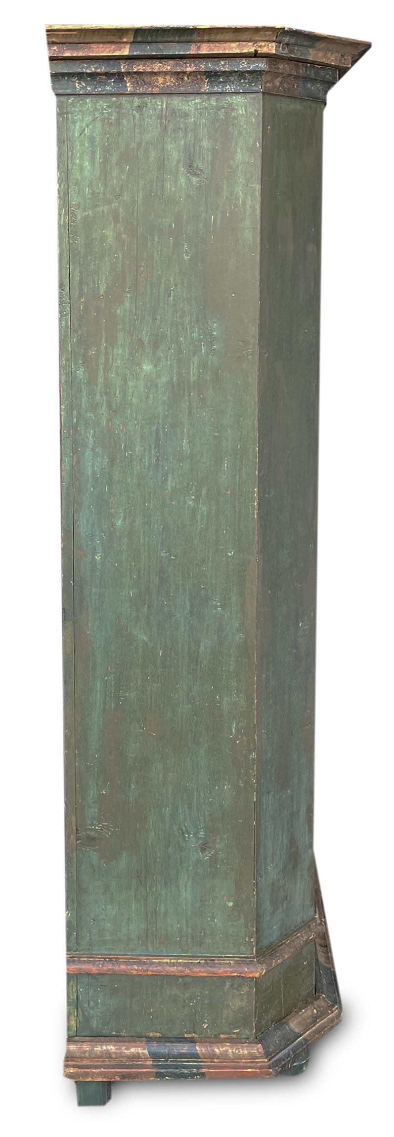 Antique Tyrolean wardrobe

Period: 1790 approximately
Origin: Tyrol (Northern Italy)
Essence: Abete
	
Measures:
Height: 201cm
Width: 145 cm (161 cm alle cornici)
Depth: 49 cm (59 cm alle cornici)

Tyrolean wardrobe painted in petrol green, with