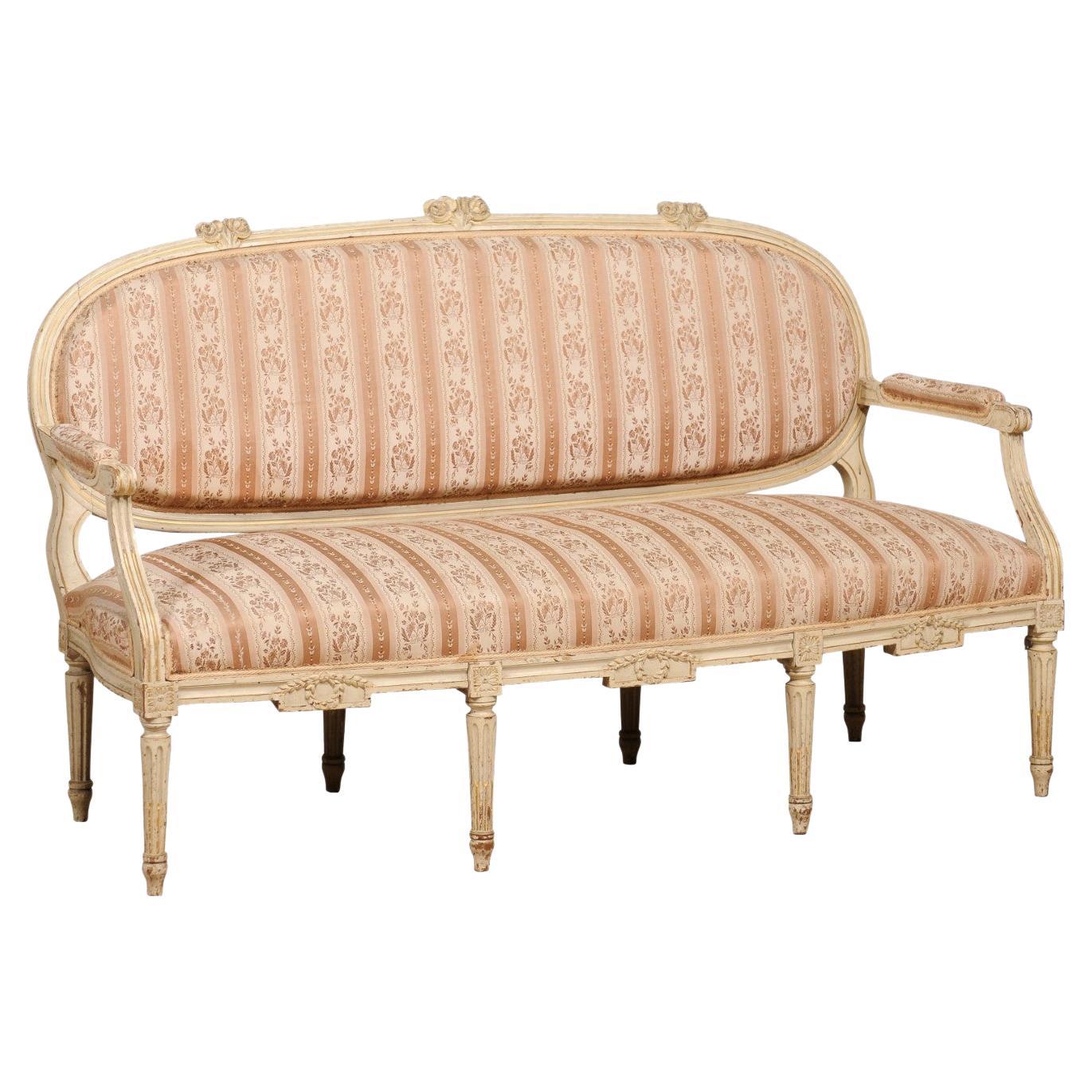 1790s Louis XVI Period French Painted Sofa with Oval Back and Carved Foliage For Sale