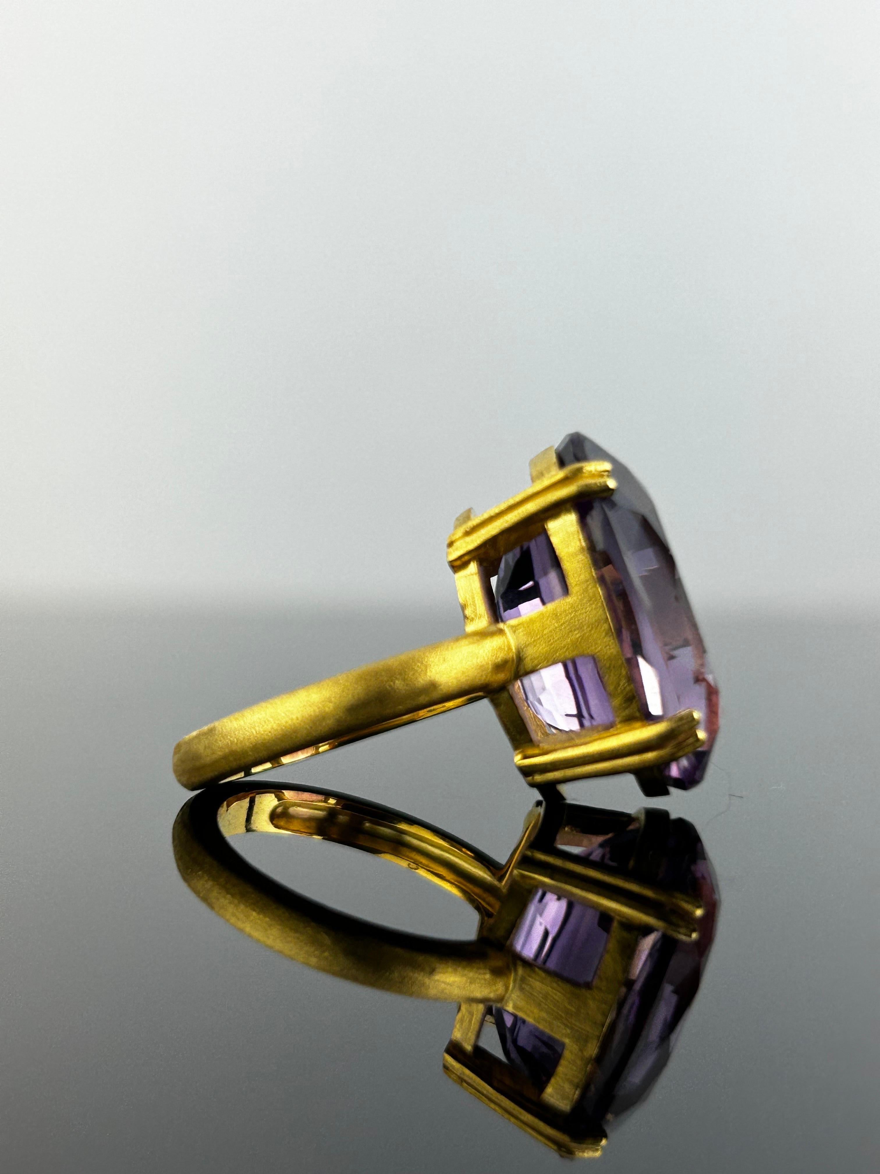 Make a statement with this stunning 17.95 carat purple Amethyst solitaire cocktail ring. The center stone is completely clean, with no inclusions at all, a beautiful purple color and great luster. The stone is set in solid 18K yellow gold, matte
