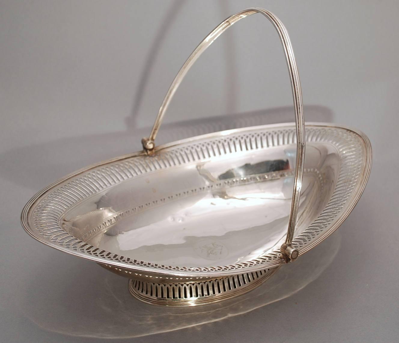 Beautiful Georgian sterling silver pierced oval basket made in London, Circa 1796. Swing handle attached to an oval body with a beautifully pierced border around the perimeter sitting on a collet foot. It is fully hallmarked as shown, though the