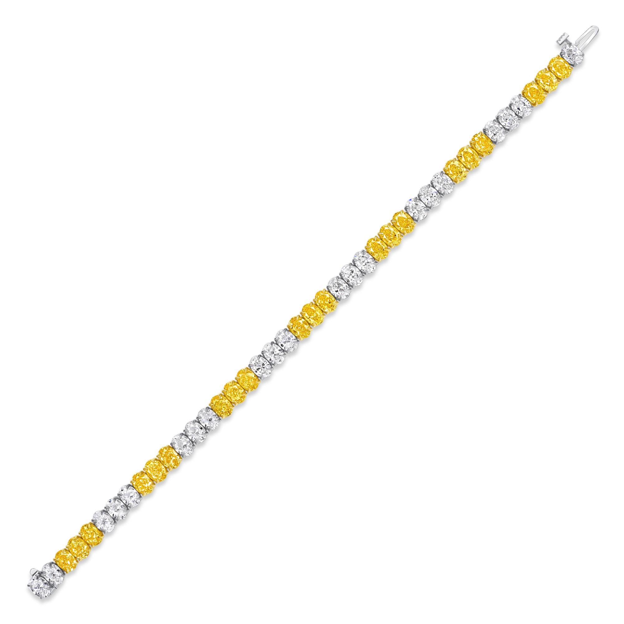 21 Oval Fancy Intense Yellow Diamond and 21 Oval Diamond with GIA certified in D-F color and VVS-VS1 clarity set in this 18K Yellow Gold & Platinum Tennis Bracelet.  It has a total weight of 17.96 carats.

