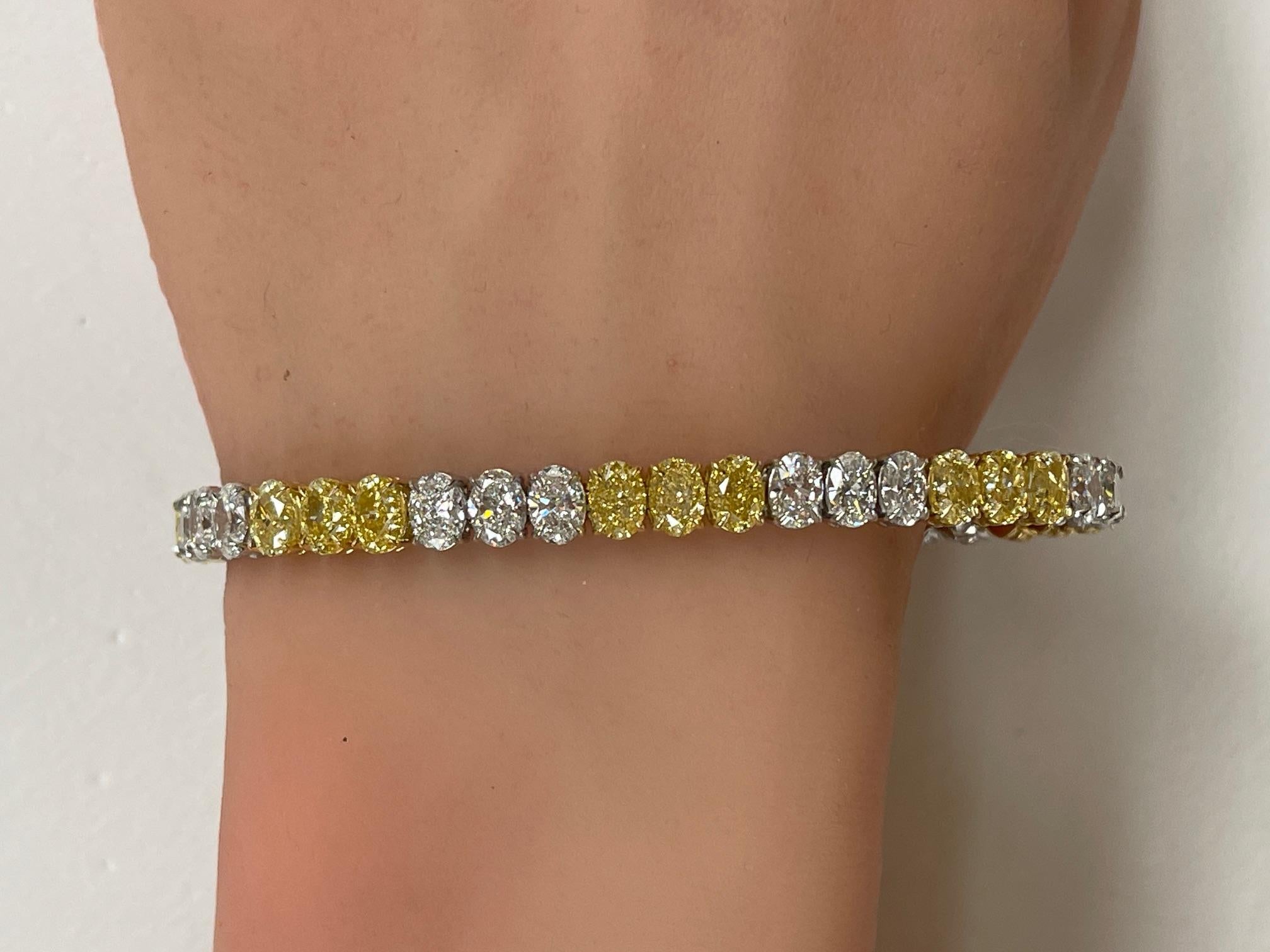 Oval Cut 17.96ctw. Fancy Intense Yellow Diamond & GIA Oval Diamond Tennis Bracelet For Sale