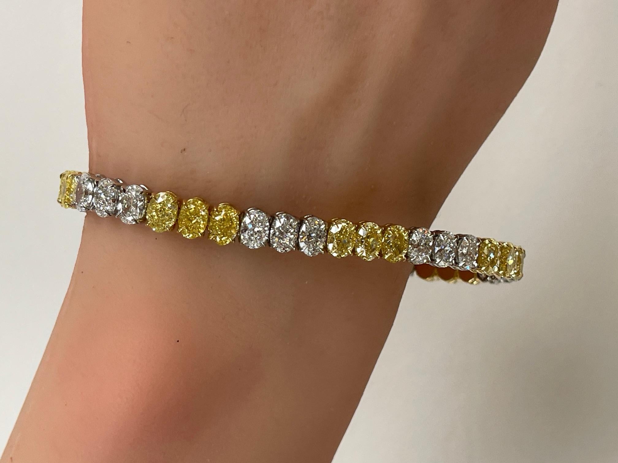 Women's 17.96ctw. Fancy Intense Yellow Diamond & GIA Oval Diamond Tennis Bracelet For Sale