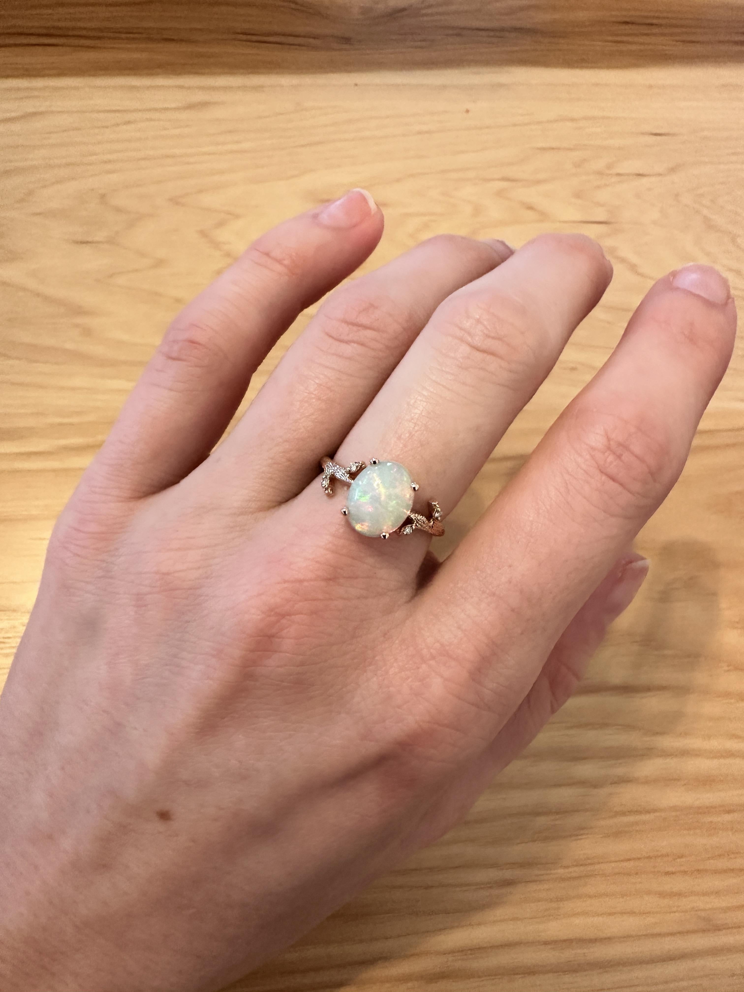 This lovely opal has all the colors of the rainbow. This glowing 1.7 carat oval opal ring is perfect for the modern bride or that special someone in your life! This opal ring also makes a beautiful October birthstone gift.

**We offer complimentary