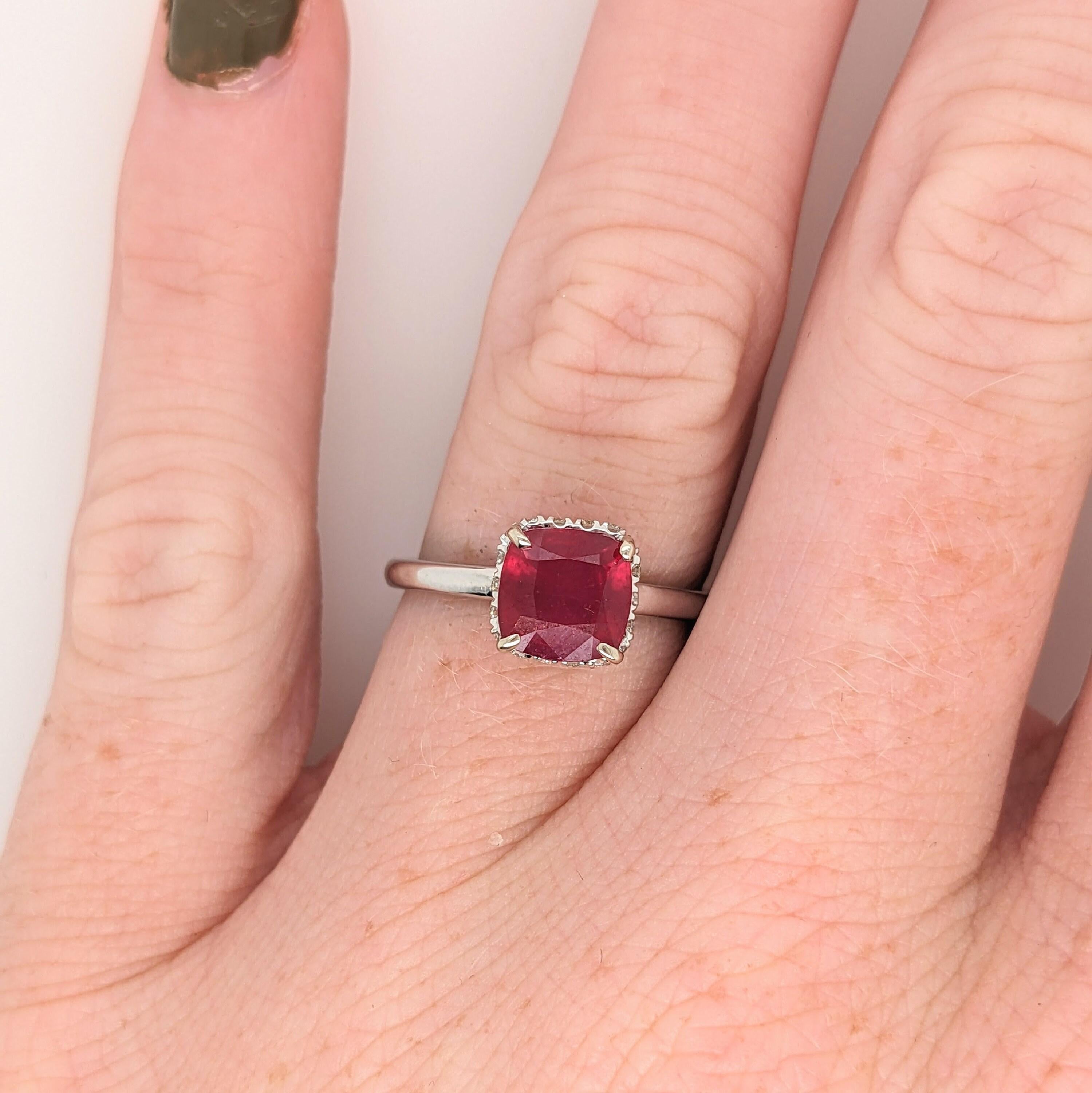 This beautiful ring features a sparkling red ruby in 14k white gold with a hidden diamond halo. A ring design perfect for an eye catching engagement or anniversary. This ring also makes a beautiful July birthstone ring for your loved ones!

The