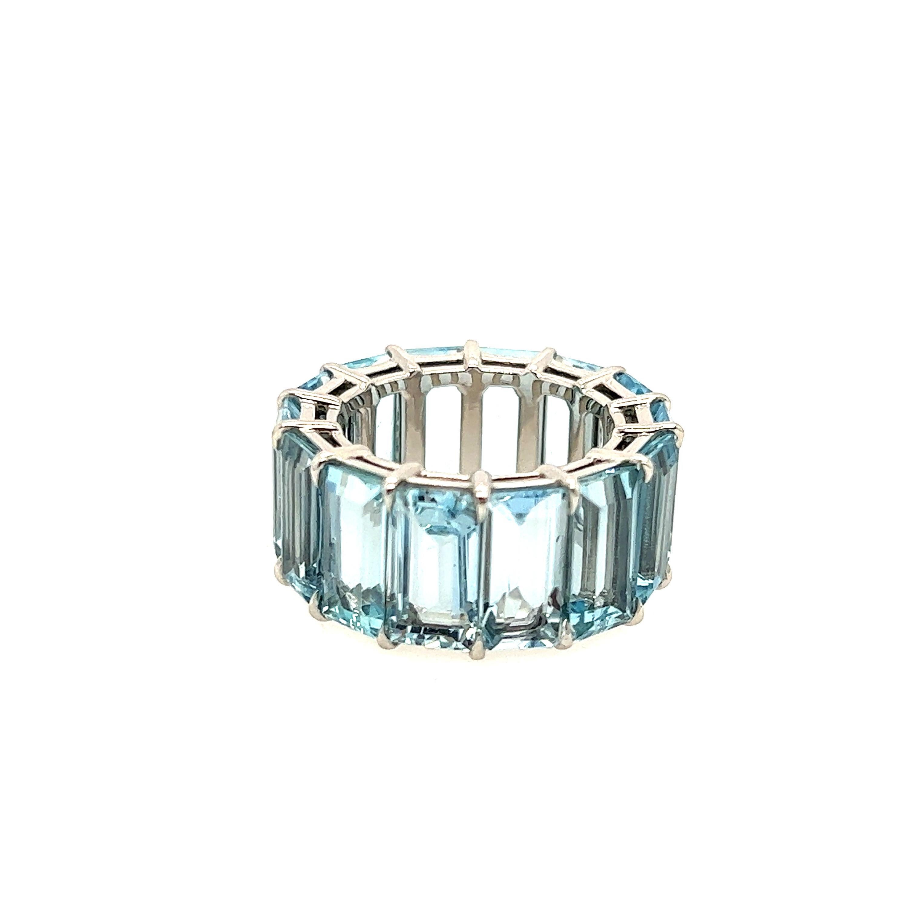 Bespoke Aquamarine platinum eternity band featuring 17cts of perfectly colored aquas. This band is very unique because the stones are extremely long and striking which only enhances the beautiful blue color. The platinum setting is so beautifully