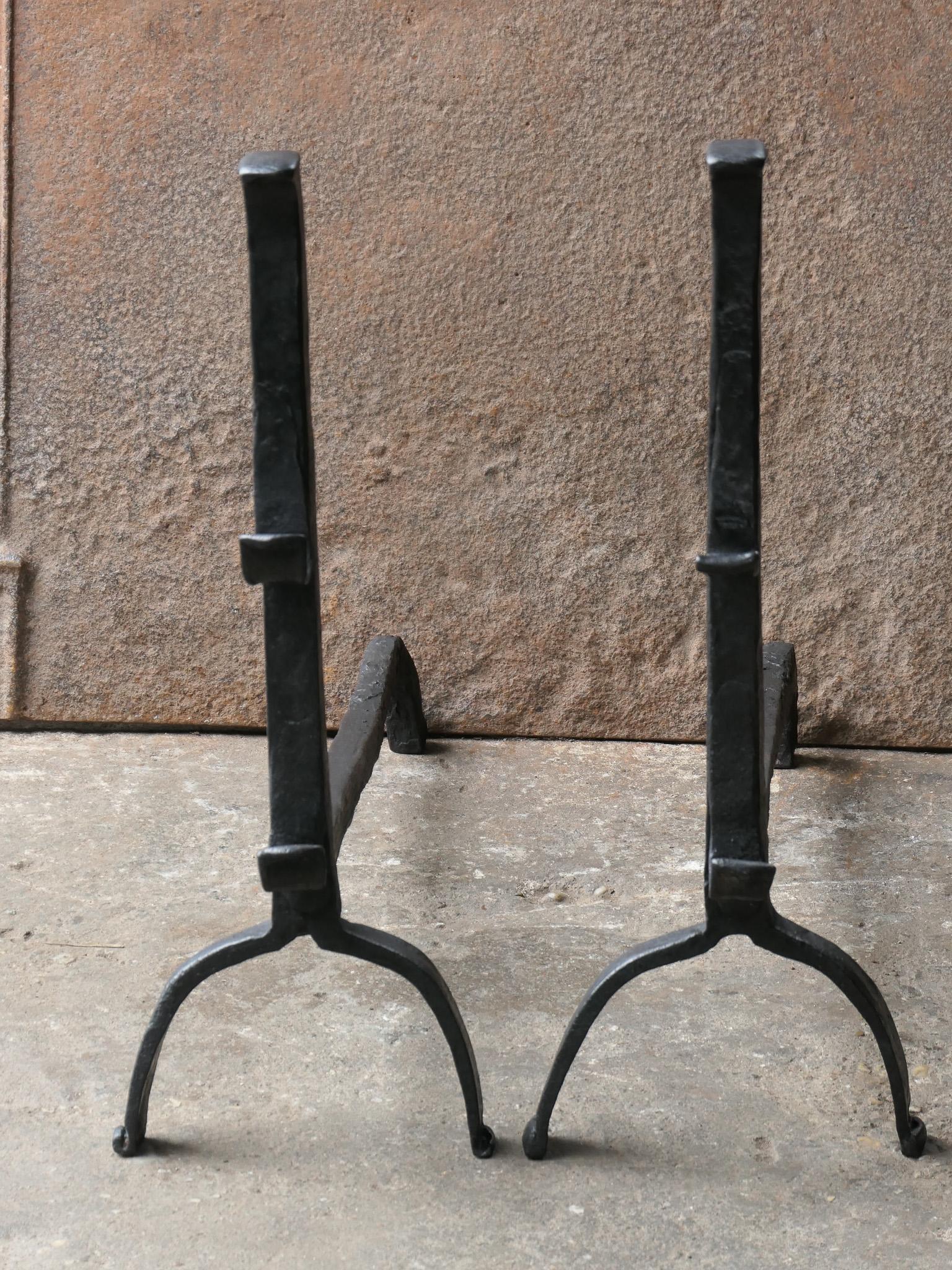 17th/18th Century English andirons made of wrought iron. The andirons have a Gothic period style. The condition is good.