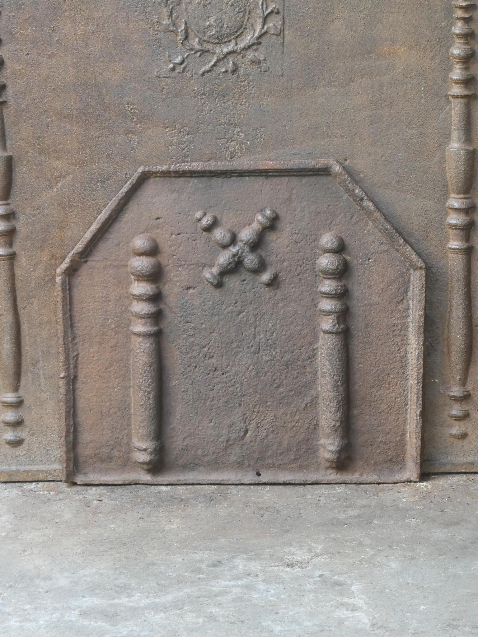 17th-18th century Louis XIV period French fireback with a Saint Andrew's cross and two pillars of Hercules. Saint Andrew is said to have been martyred on a cross in this shape. As a result the cross became a sign for humility and sacrifice. The