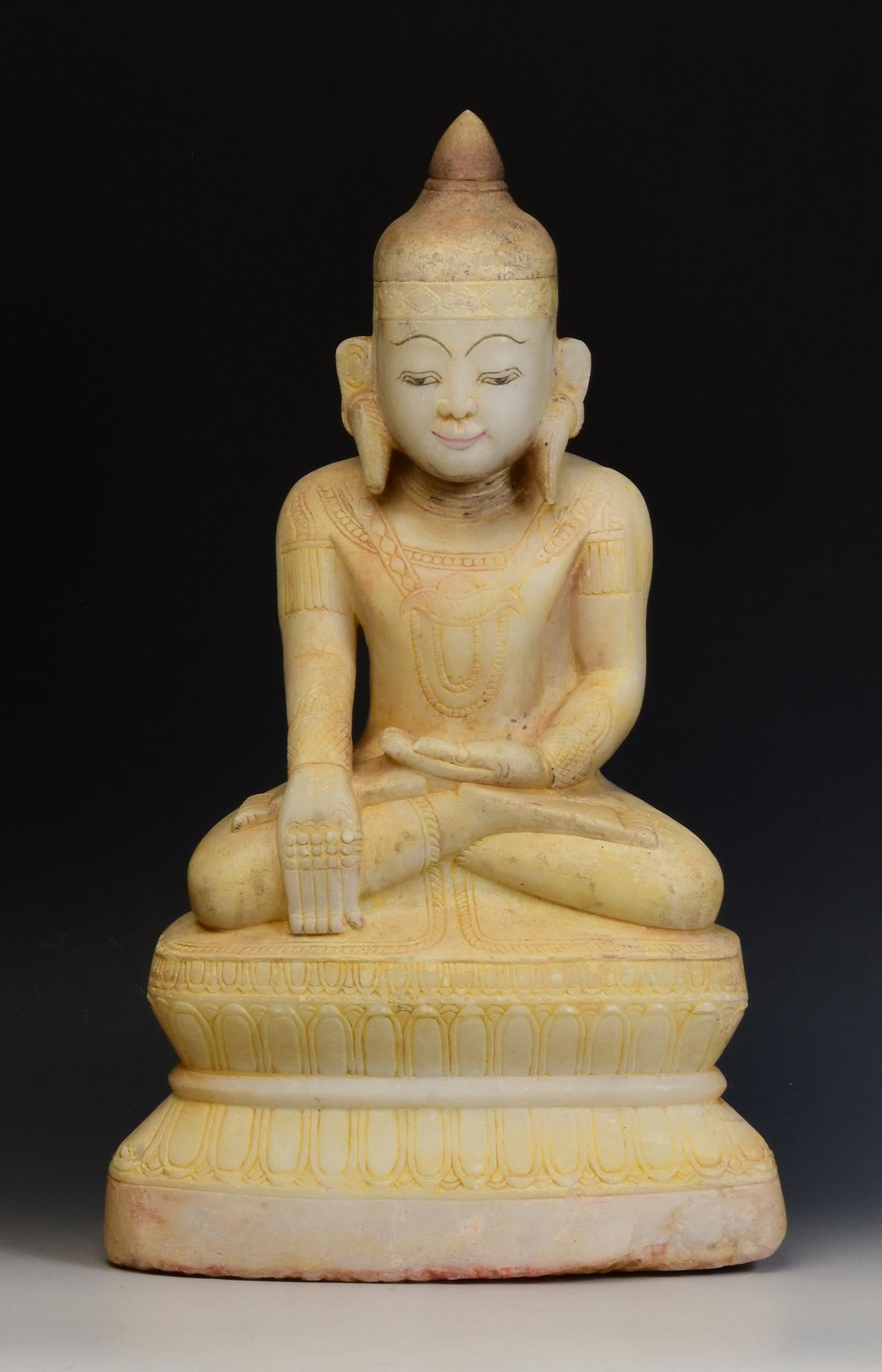Antique Burmese alabaster seated crowned Buddha, or also known as 'King Buddha', wearing diadem-crowns and ornaments of kings instead of ordinary monk's robes.

Age: Burma, Ava Period, 15th Century
Size: Height 51.5 C.M. / Width 30.5 C.M. / Depth