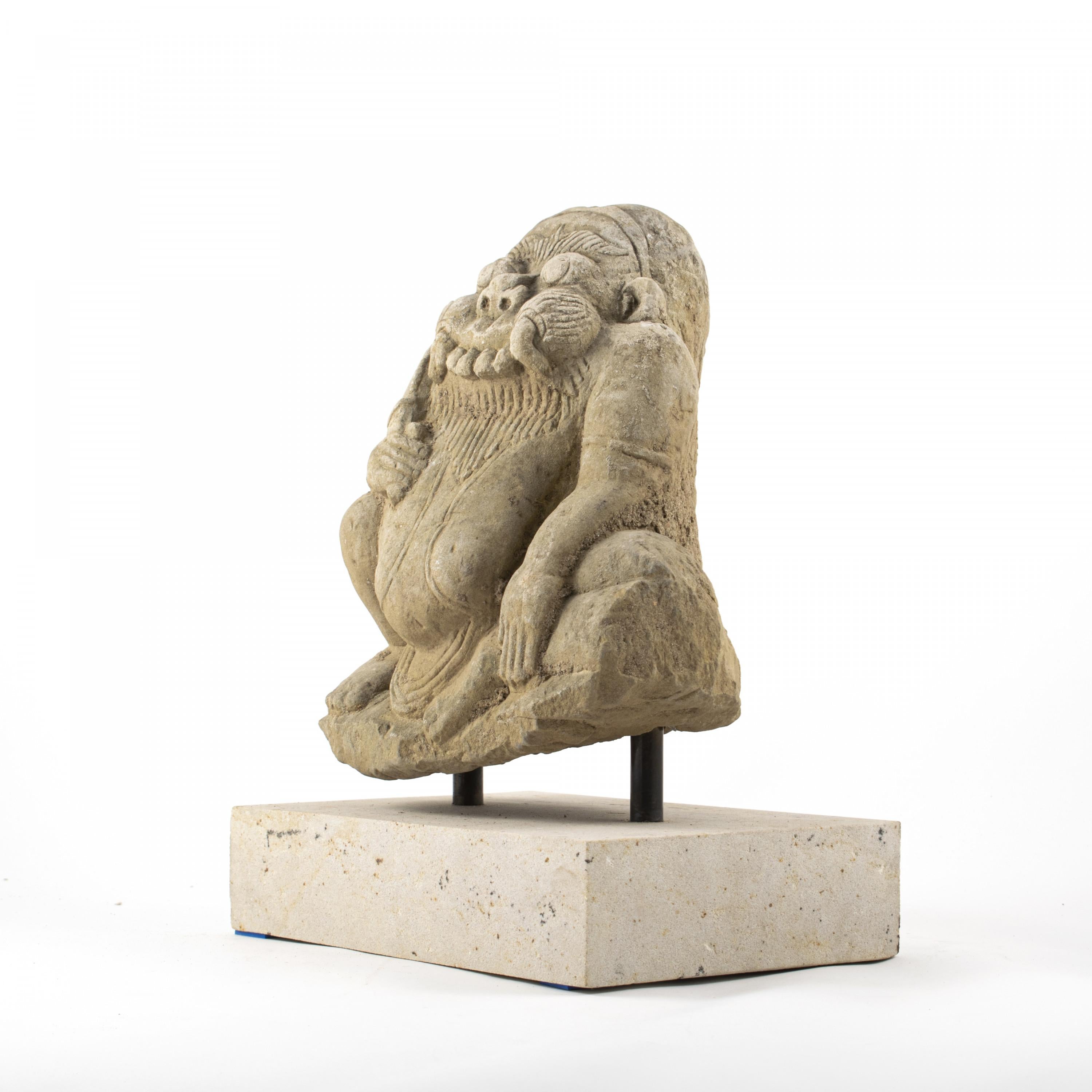 300-400 year old Burmese carved sandstone temple statue depicting a demon.
The demon supposed to protect the temple and scare evil spirits away.
In original untouched condition.
Mounted on light sandstone base.
17th-18th century, Arakan,