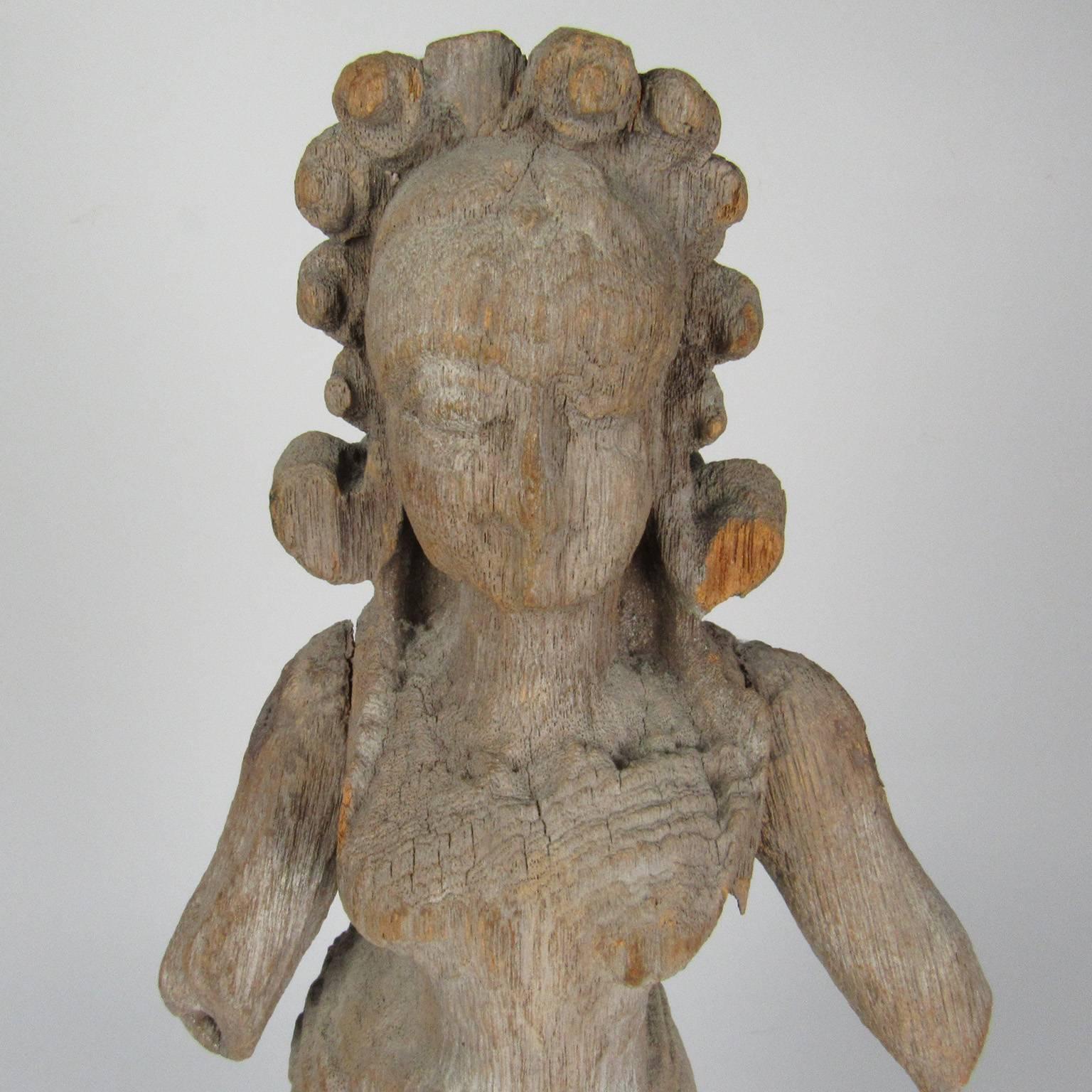 Carved wood figure of a female Hindu deity, regional style, probably Nepal, 17th-18th century. Measures: Height 17 1/2 inches.
