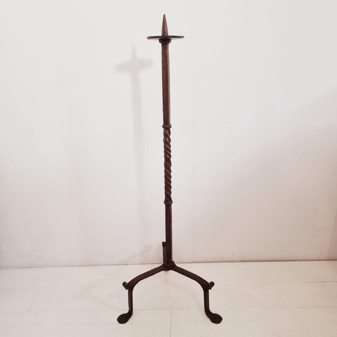Spectacular hand forged iron candleholder with beautiful patina
France, circa 1650-1750
Good but weathered condition.