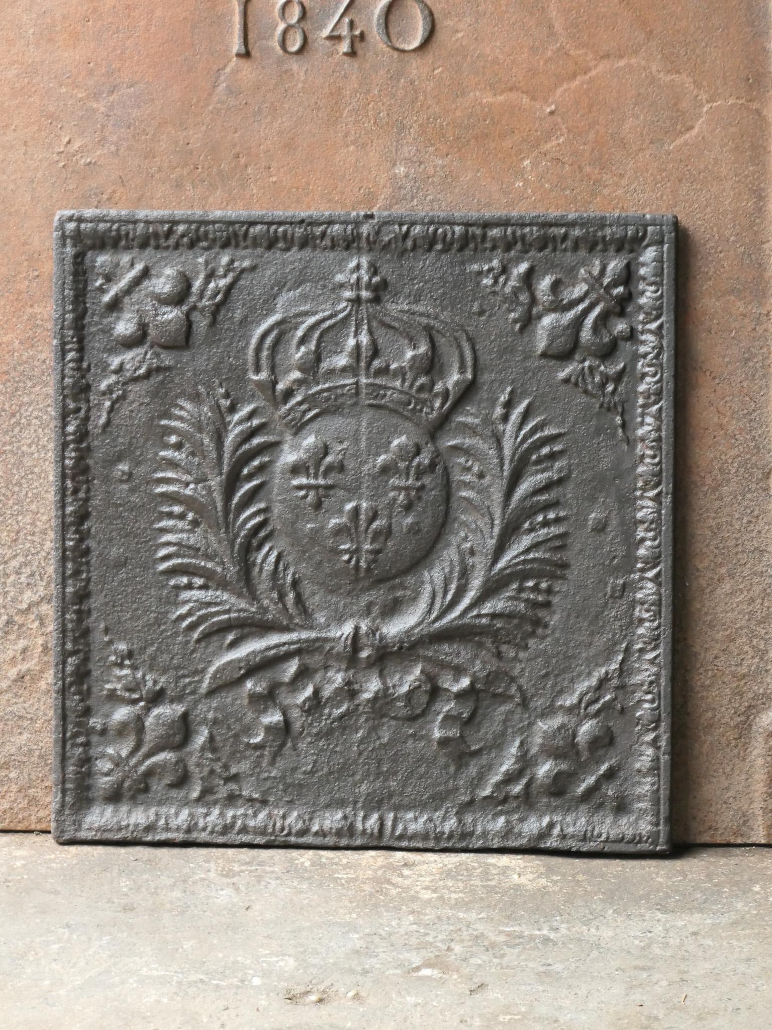17th - 18th century French Louis XIV period fireback with the Arms of France. A coat of arms of the House of Bourbon, an originally French royal house that became a major dynasty in Europe. The house delivered kings for Spain (Navarra), France, both