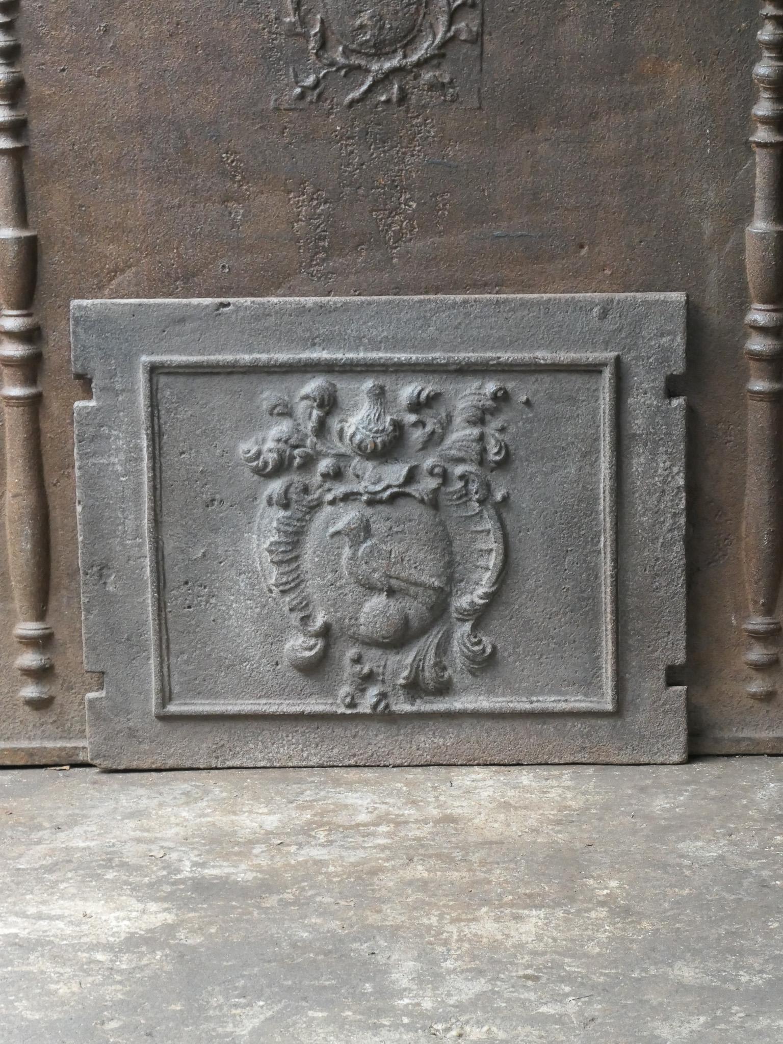 Beautiful 17th-18th century French Louis XIV fireback with an unknown coat of arms.

The fireback is made of cast iron and has a brown patina. It can be made black / pewter upon request. It is in a good condition, no cracks.


