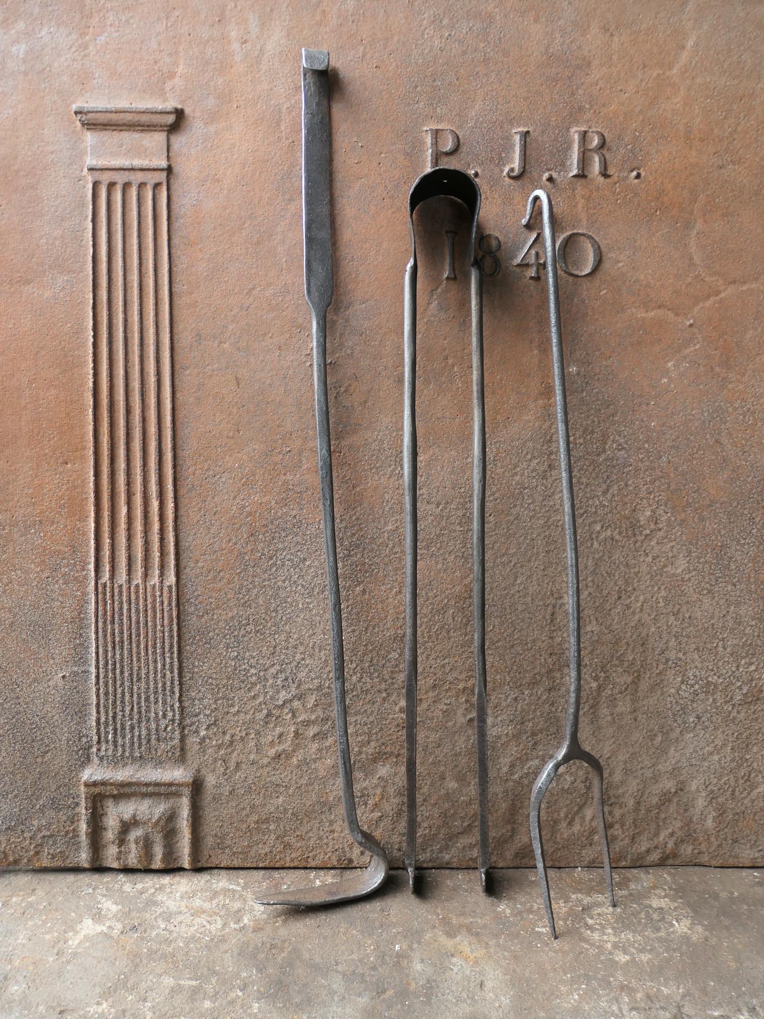 17th - 18th century French Louis XIV fireplace toolset. The toolset, consisting of tongs, a shovel and a poker, is made of wrought iron. It is in a good condition and it is fully functional.








