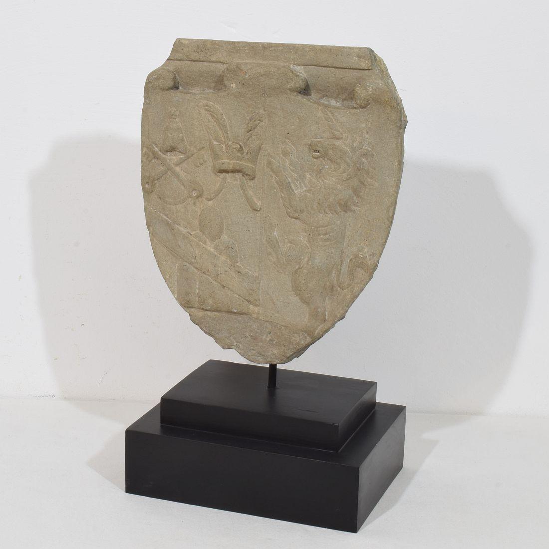 Very beautiful hand carved stone coat of arms with a unicorn. 
Italy, circa 1650-1750. Weathered.
Measurement here below is inclusive the wooden base.
H:45,5cm  W:27cm D:18,5cm 