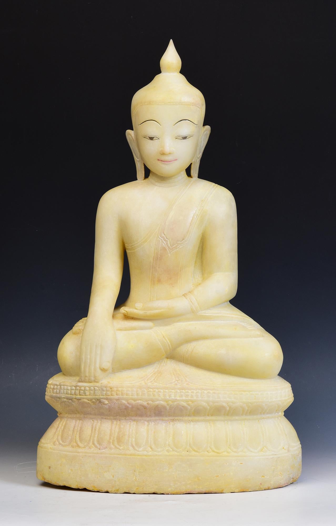 Antique Burmese alabaster Buddha sitting in Mara Vijaya (calling the earth to witness) posture on a base.

Age: Burma, Shan Period, 17th - 18th Century
Size: Height 55 C.M. / Width 32 C.M. / Depth 18.5 C.M.
Condition: Nice condition overall (some