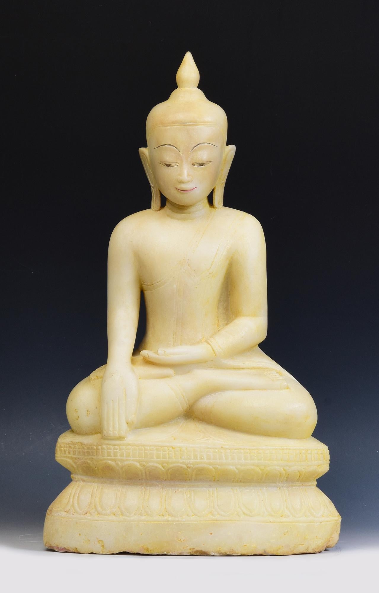 Antique Burmese alabaster Buddha sitting in Mara Vijaya (calling the earth to witness) posture on a base.

Age: Burma, Shan Period, 17th - 18th Century
Size: Height 55 C.M. / Width 32.5 C.M. / Depth 19 C.M.
Condition: Nice condition overall (some