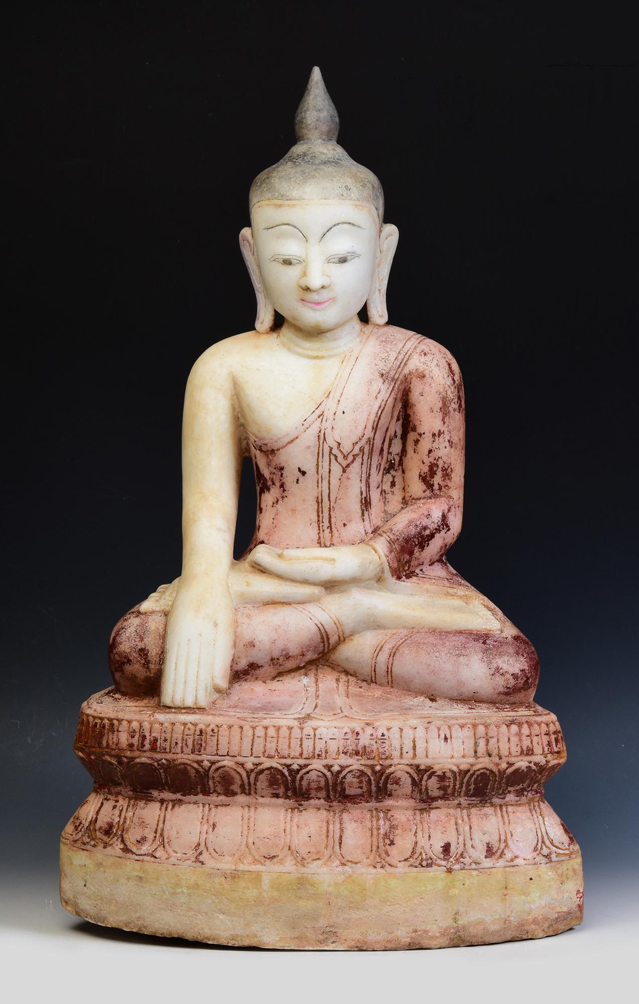 Antique Burmese alabaster Buddha sitting in Mara Vijaya (calling the earth to witness) posture on a base.

Age: Burma, Shan Period, 17th - 18th Century
Size: Height 64.3 C.M. / Width 38 C.M. / Depth 21.5 C.M.
Condition: Nice condition overall (some