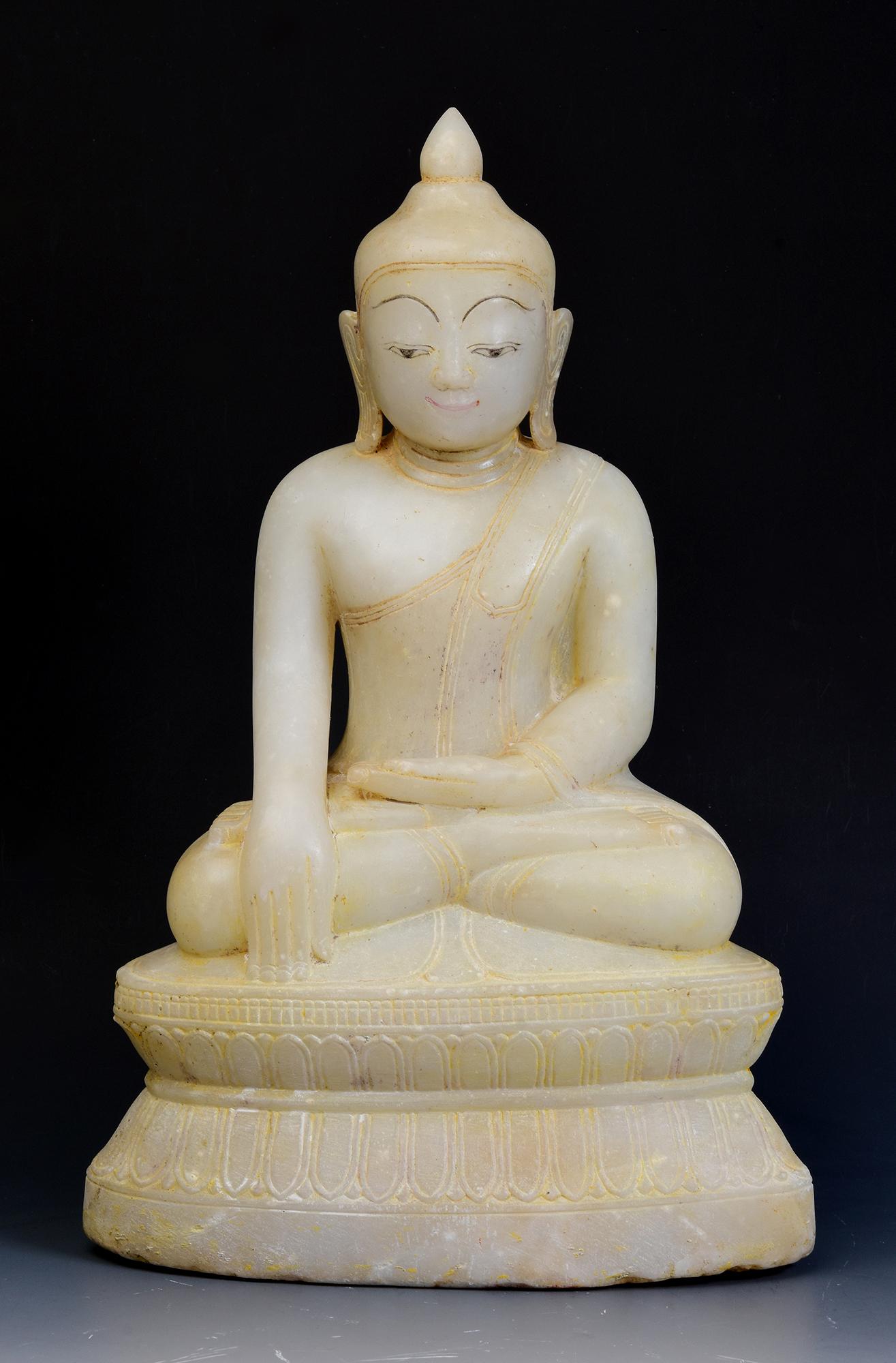 Antique Burmese alabaster Buddha sitting in Mara Vijaya (calling the earth to witness) posture on a base.

Age: Burma, Shan Period, 17th - 18th Century
Size: Height 42.4 C.M. / Width 26.5 C.M. / Depth 16 C.M.
Condition: Nice condition overall (some