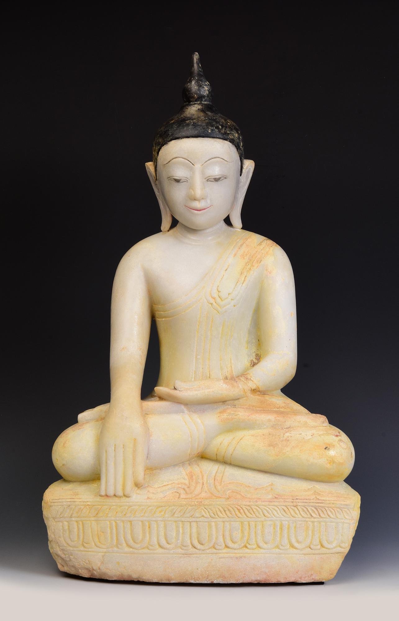 Antique Burmese alabaster Buddha sitting in Mara Vijaya (calling the earth to witness) posture on a base.

Age: Burma, Shan Period, 17th - 18th Century
Size: Height 54 C.M. / Width 33 C.M. / Depth 21 C.M.
Condition: Nice condition overall (some