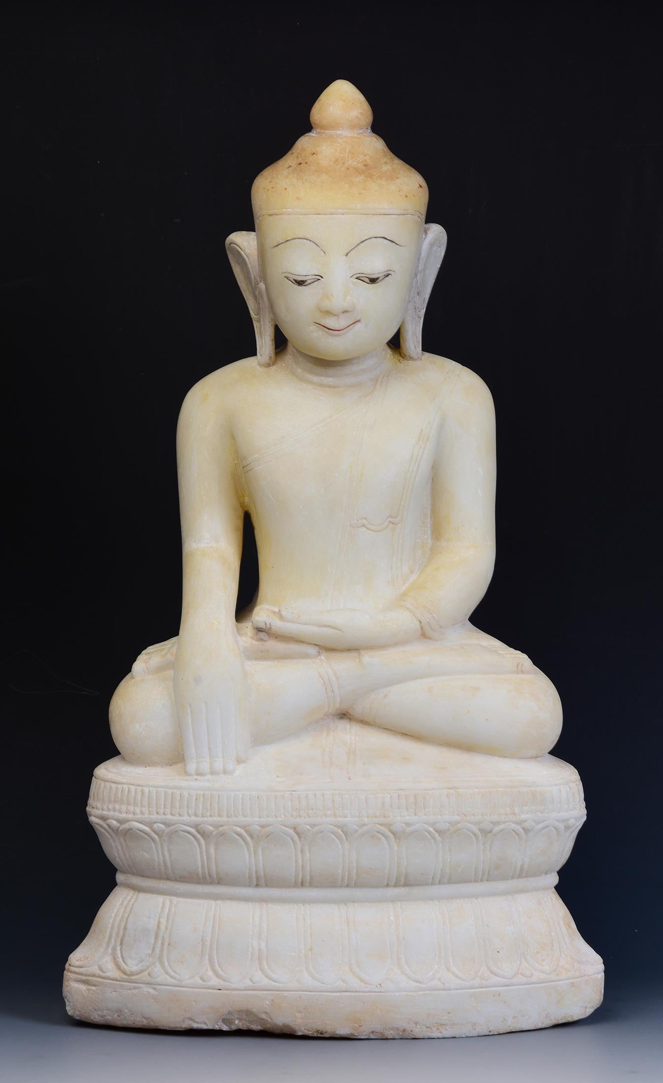 Burmese alabaster Buddha sitting in Mara Vijaya (calling the earth to witness) posture on a base.

Age: Burma, Shan Period, 17th - 18th Century
Size: Height 56 C.M. / Width 32 C.M.
Condition: Nice condition overall (some expected degradation due
