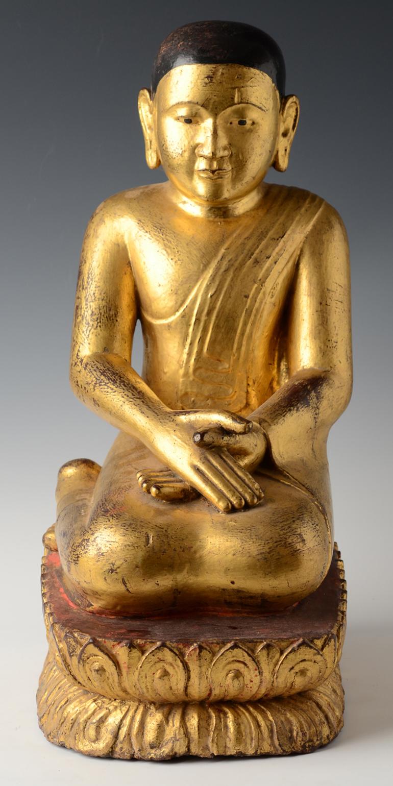 Antique Burmese wooden seated disciple on double lotus base, with gilded gold.

Age: Burma, Shan Period, 17th - 18th Century
Size: Height 51.5 C.M. / Width 23.7 C.M.
Condition: Nice condition overall (some expected degradation due to its age).