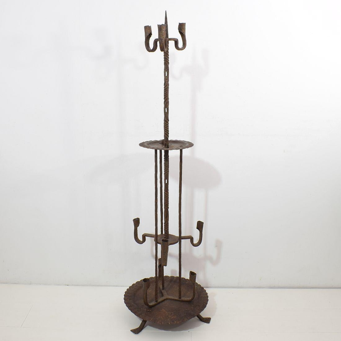 Spectacular hand forged iron candleholder that can be adjusted in height.
Spain, circa 1650-1750
Measures: H 102/151cm, W 36cm, D 36cm
Good but weathered condition.