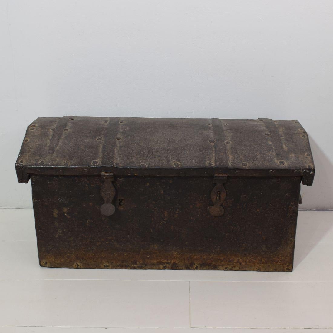 Beautiful and rare strongbox from Spain.
Wrought iron on wood.
Spain, circa 1650-1750.
Weathered, old repairs. Traces of inactive woodworm visible.