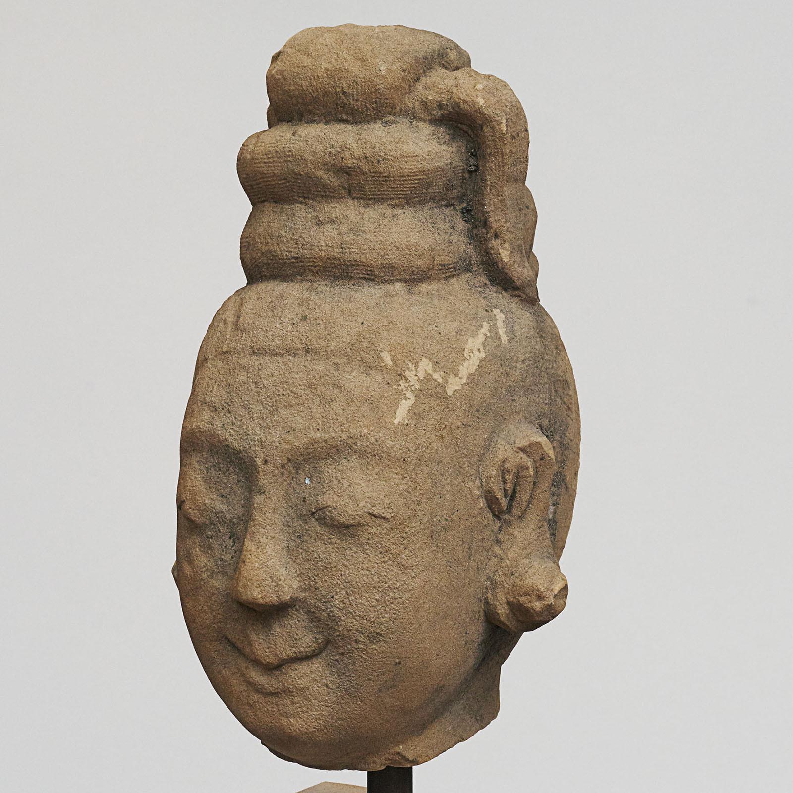 17th-18th century woman's head, carved in sandstone. From pagoda / temple in Burma. Mounted on a light sandstone base. Charming, untouched with good charisma.