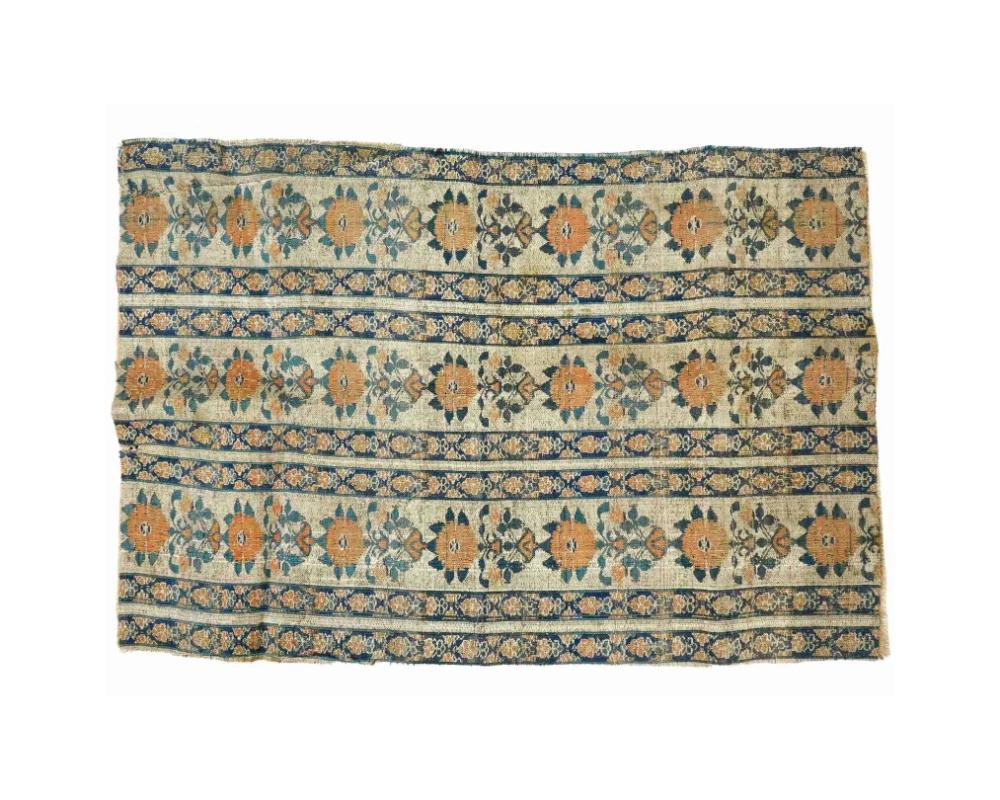 An antique Persian Iranian Safavid dynasty hand woven embroidered textile, circa 17th century, showcases the dynastys intricate craftsmanship. The fabric features horizontal bands filled with alternating orange floral medallions, set against a beige