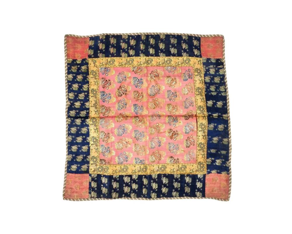 An antique Persian Iranian Safavid dynasty hand woven embroidered textile. Circa: 17th century. The textile displays intricate hand woven patterns featuring repeating golden birds and floral medallions. Safavid Iran or Safavid Persia, also referred