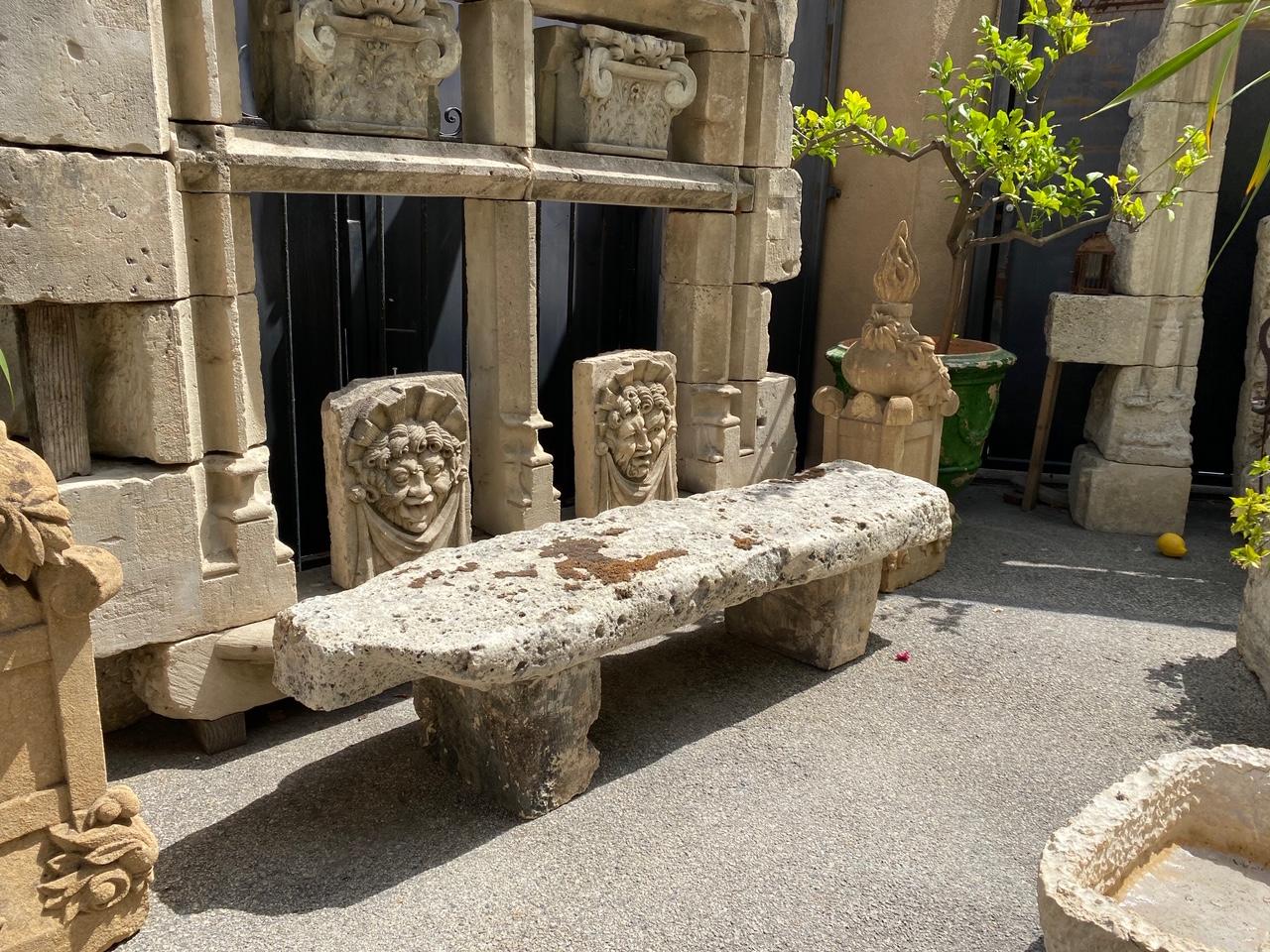 17th century hand carved garden stone bench. This rustic beauty is a rare piece indeed A beautiful garden bench simple lines that works in an interior as a seating or decorative architectural sculpted element. Mounted against a wall in a modern