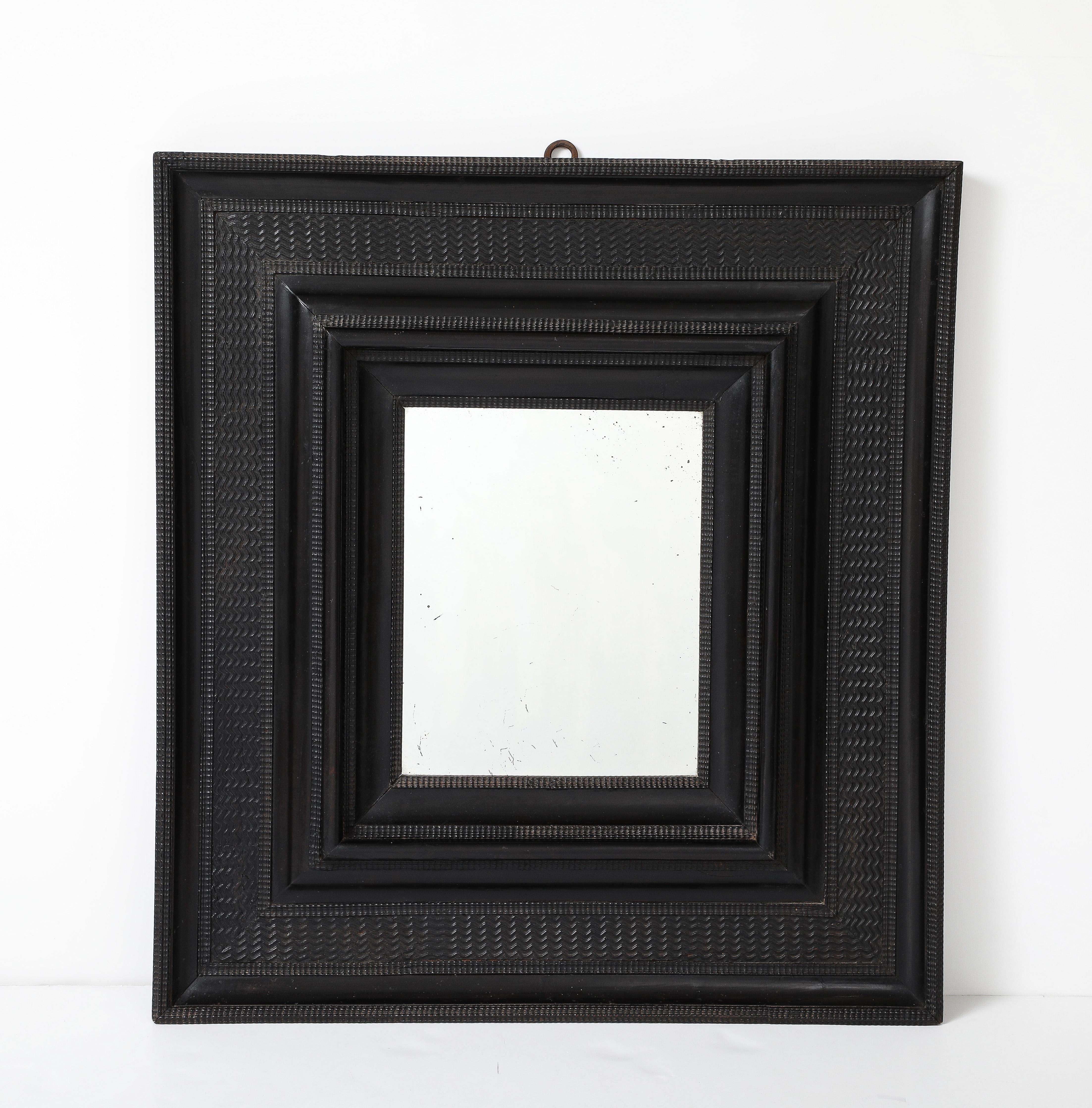 17th C. Italian Ebonized Fruitwood Mirror, 19th C. Mercury Glass Interior Mirror

H: 38.5 D: 1.5 W: 35 in.
