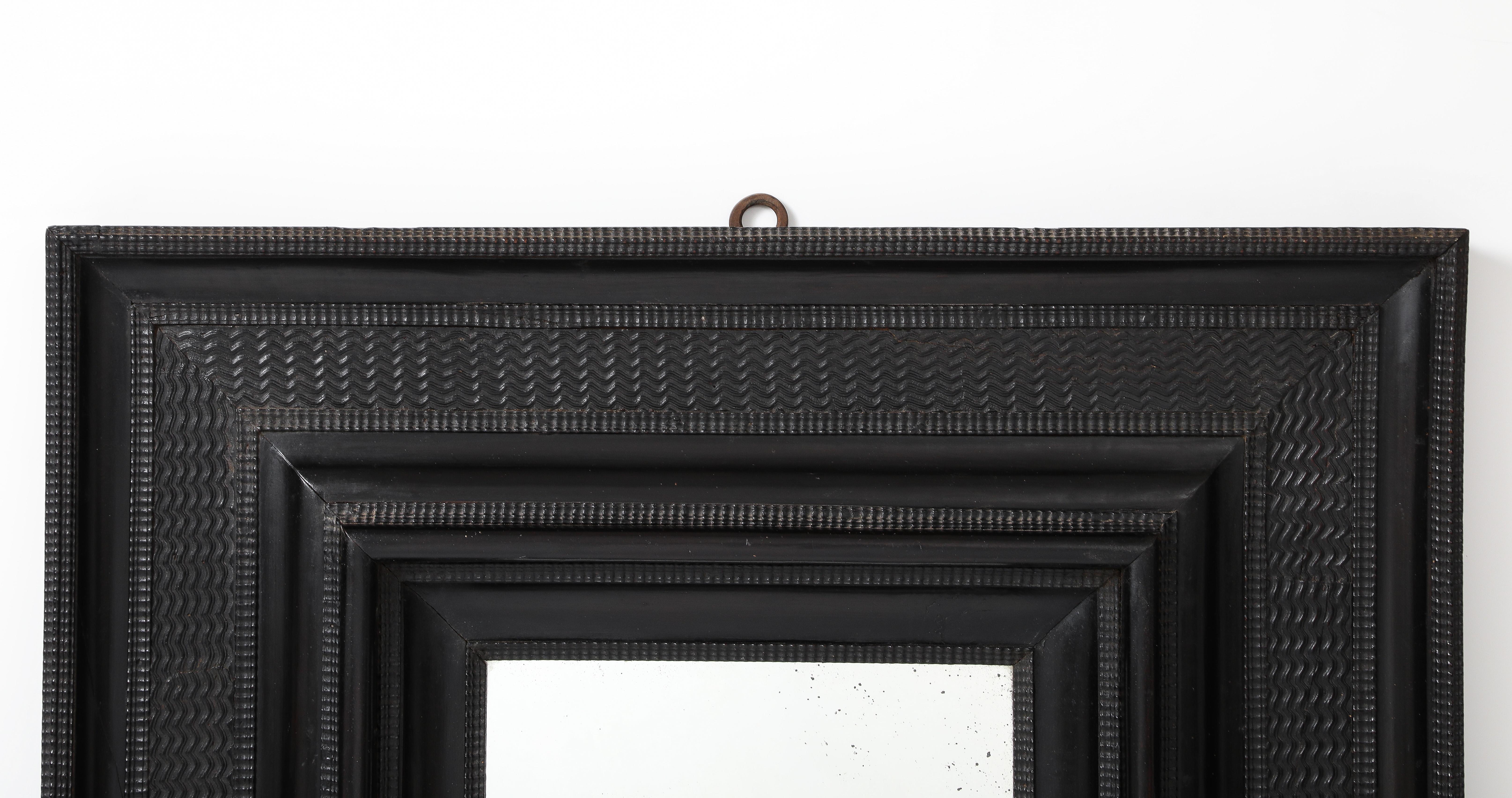 Carved 17th C. Italian Ebonized Fruitwood Mirror 19th C. Mercury Glass Interior Mirror For Sale