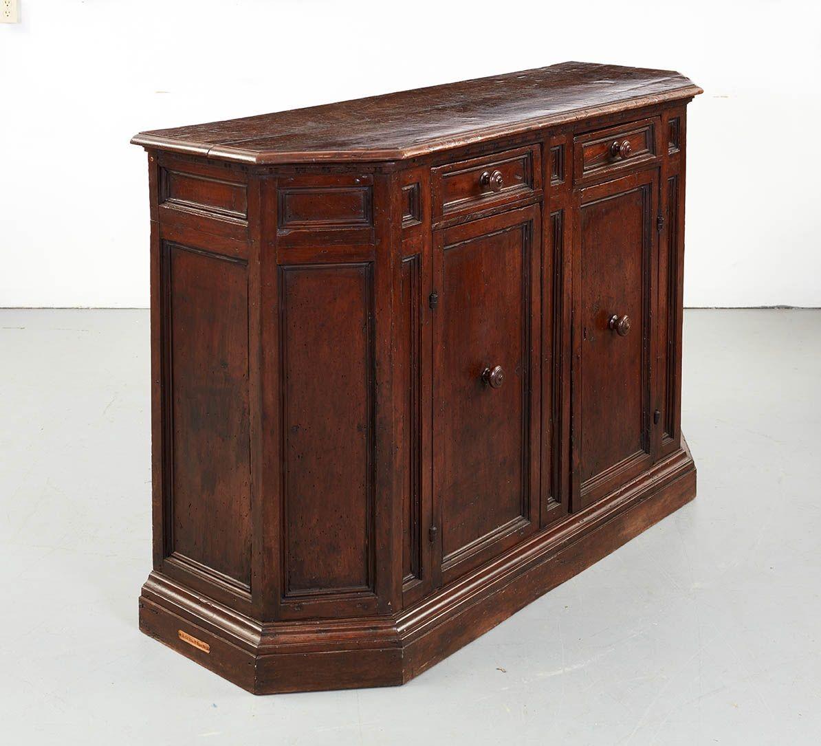 Substantial Italian Baroque walnut credenza, the top with thumb molded edge and canted corners over conforming cabinet with two drawers over two cupboard doors, the whole with good moldings, deep rich patina and impressive presence. Probably Tuscan,