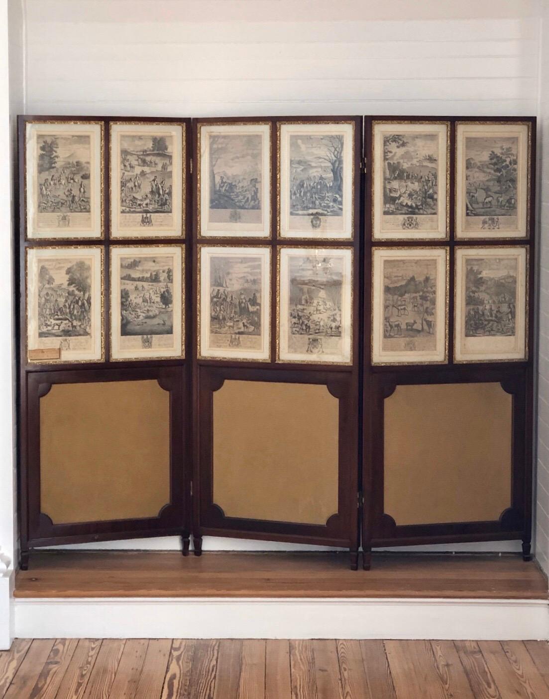 Regal set of twenty-four steel engravings of English Hunt Scenes by Richard Blome (1635-1705) framed in a pair of three panel mahogany Regency Screens, 17th century. The etchings are from 