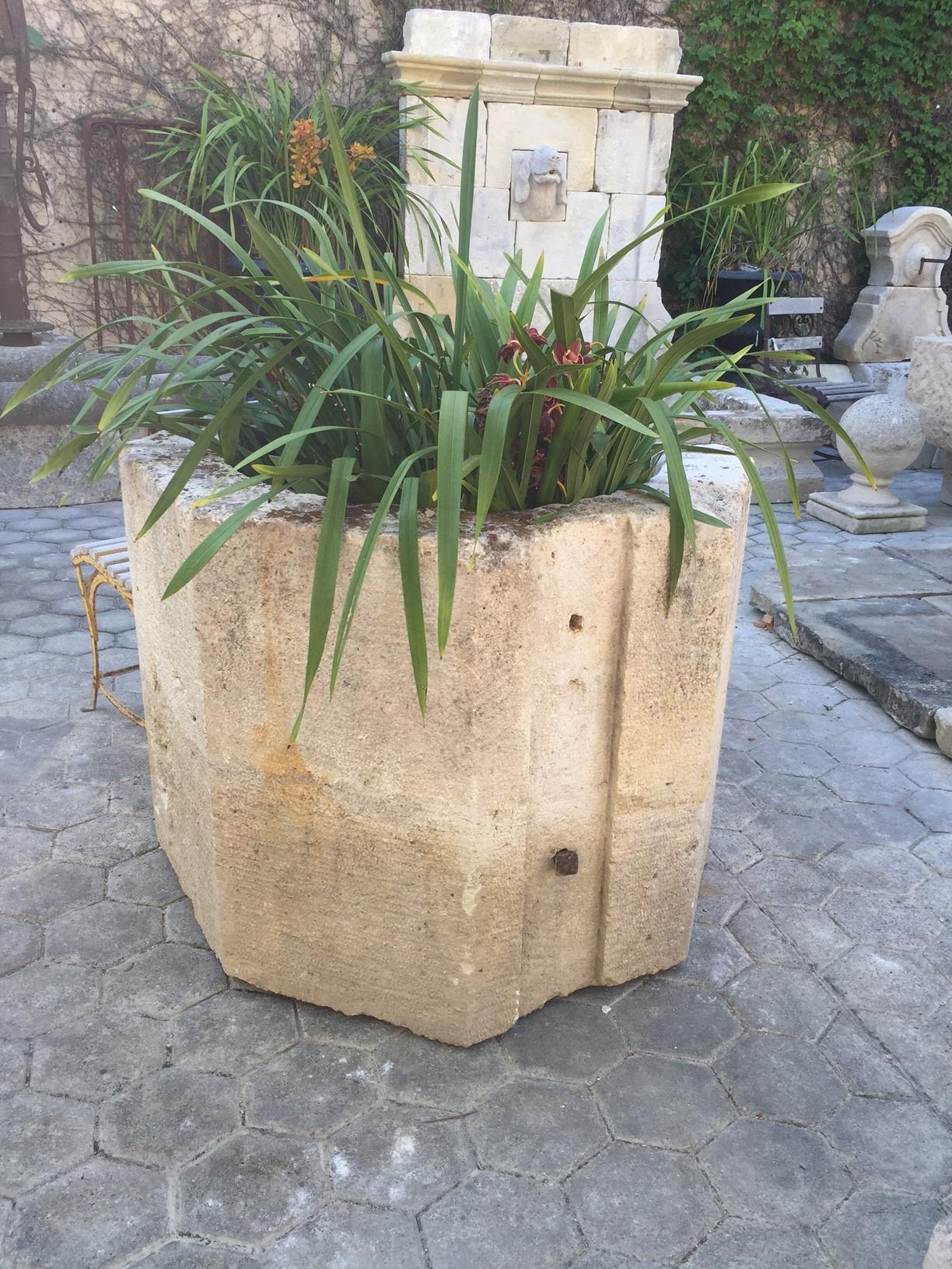     A rare hand carved 17th century hand well head octagonal round shape with carved out corners. Simple geometric lines on this vessel rustic in feel. To be used in a modern traditional Spanish French design, very versatile as an interior planter