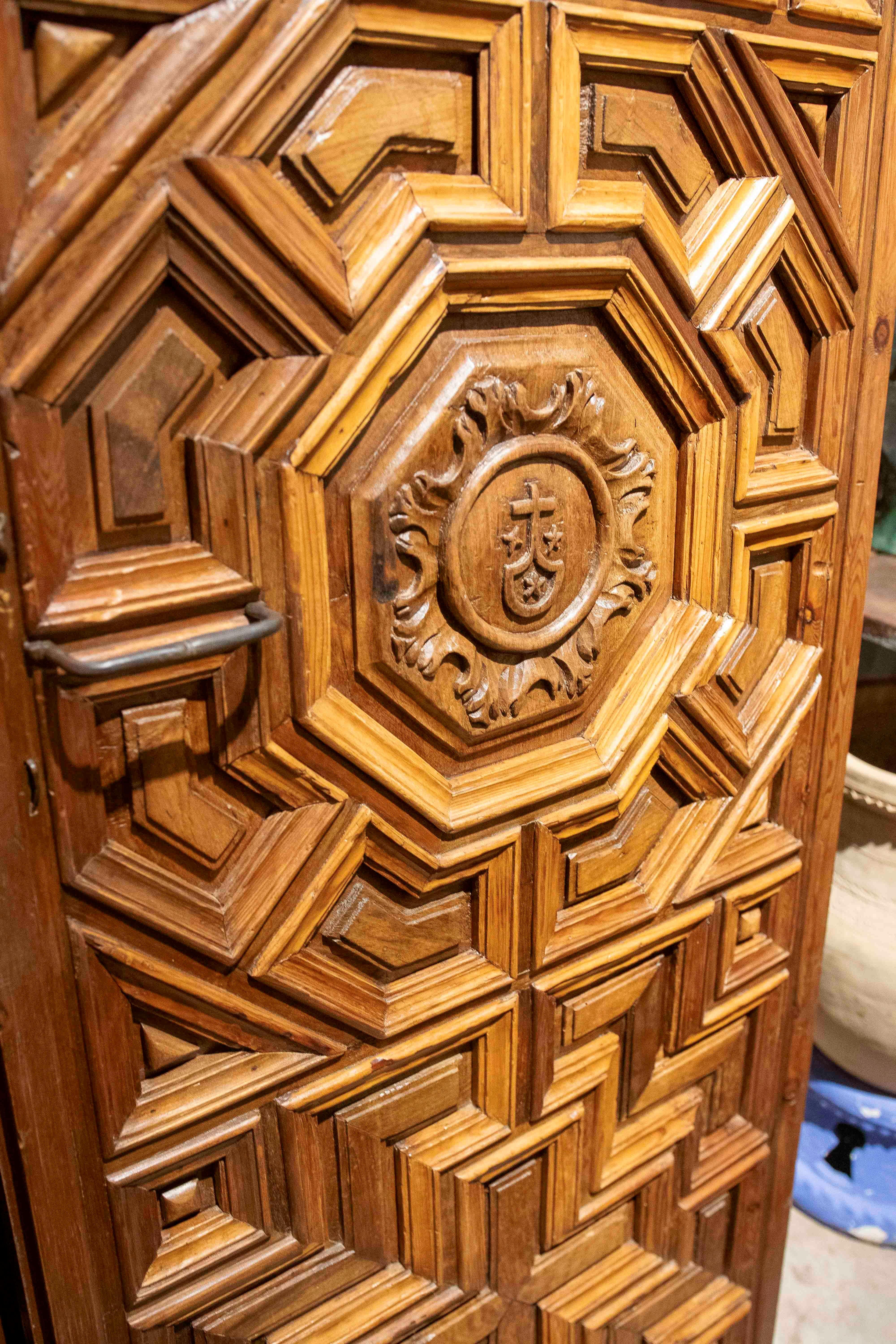 18th Century and Earlier 17th Carved Wooden Door with Mudejar Geometric Motif and Central Emblem For Sale